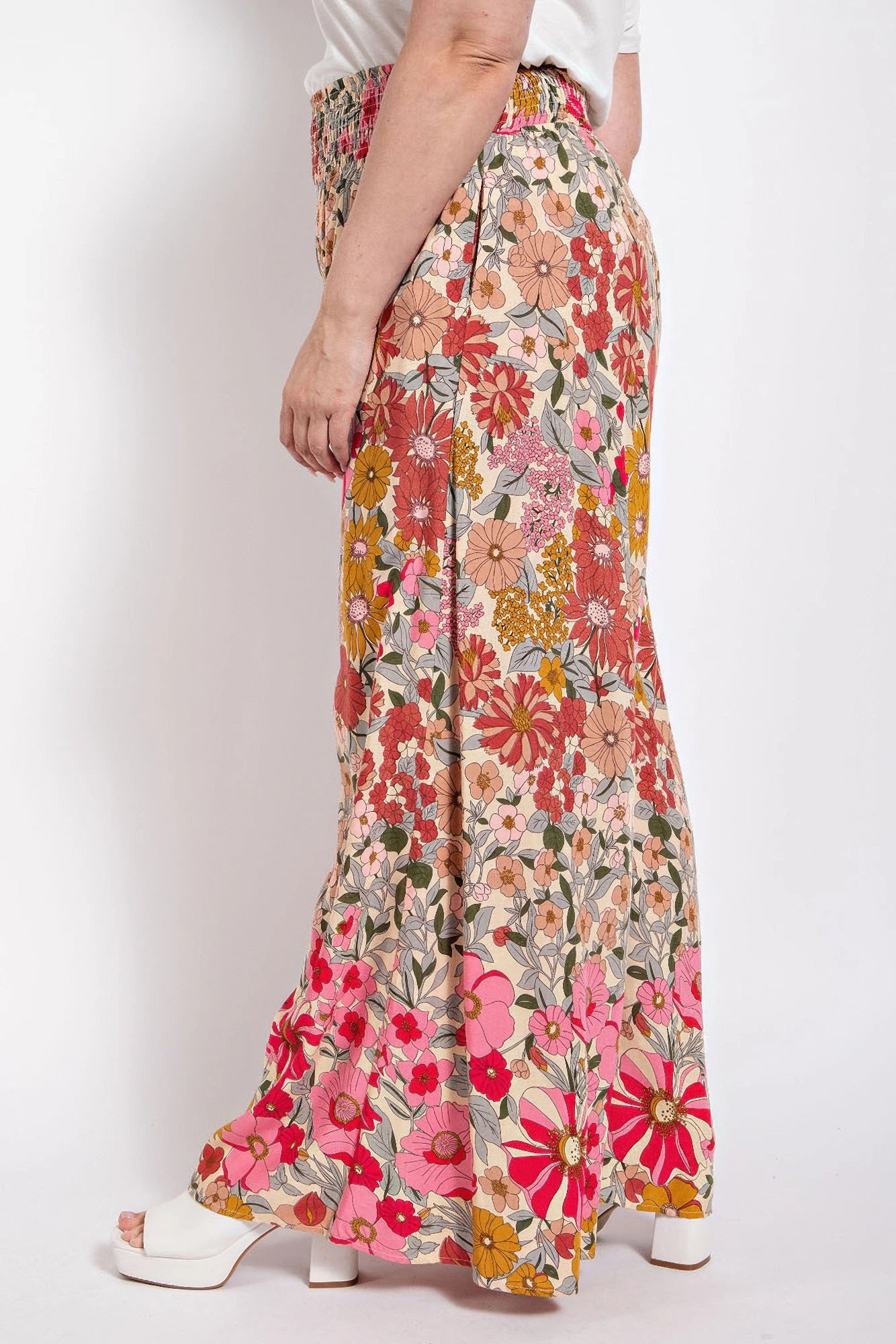 Multicolor floral flare pants with elastic smocked waist and side pockets