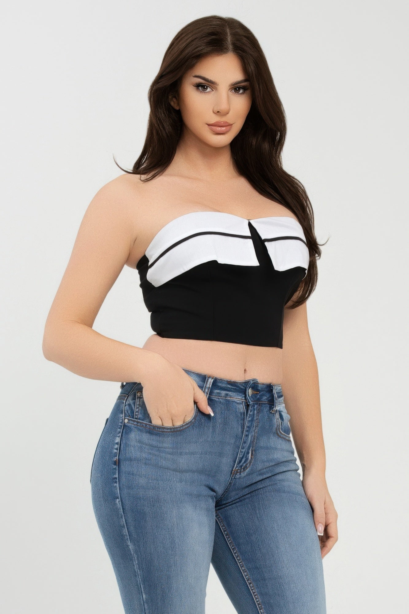 Close-up view of black-and-white fold-over strapless tube top, center notch