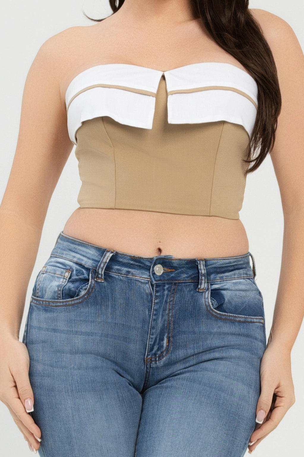 Close-up of khaki-and-white fold-over strapless tube top, center notch