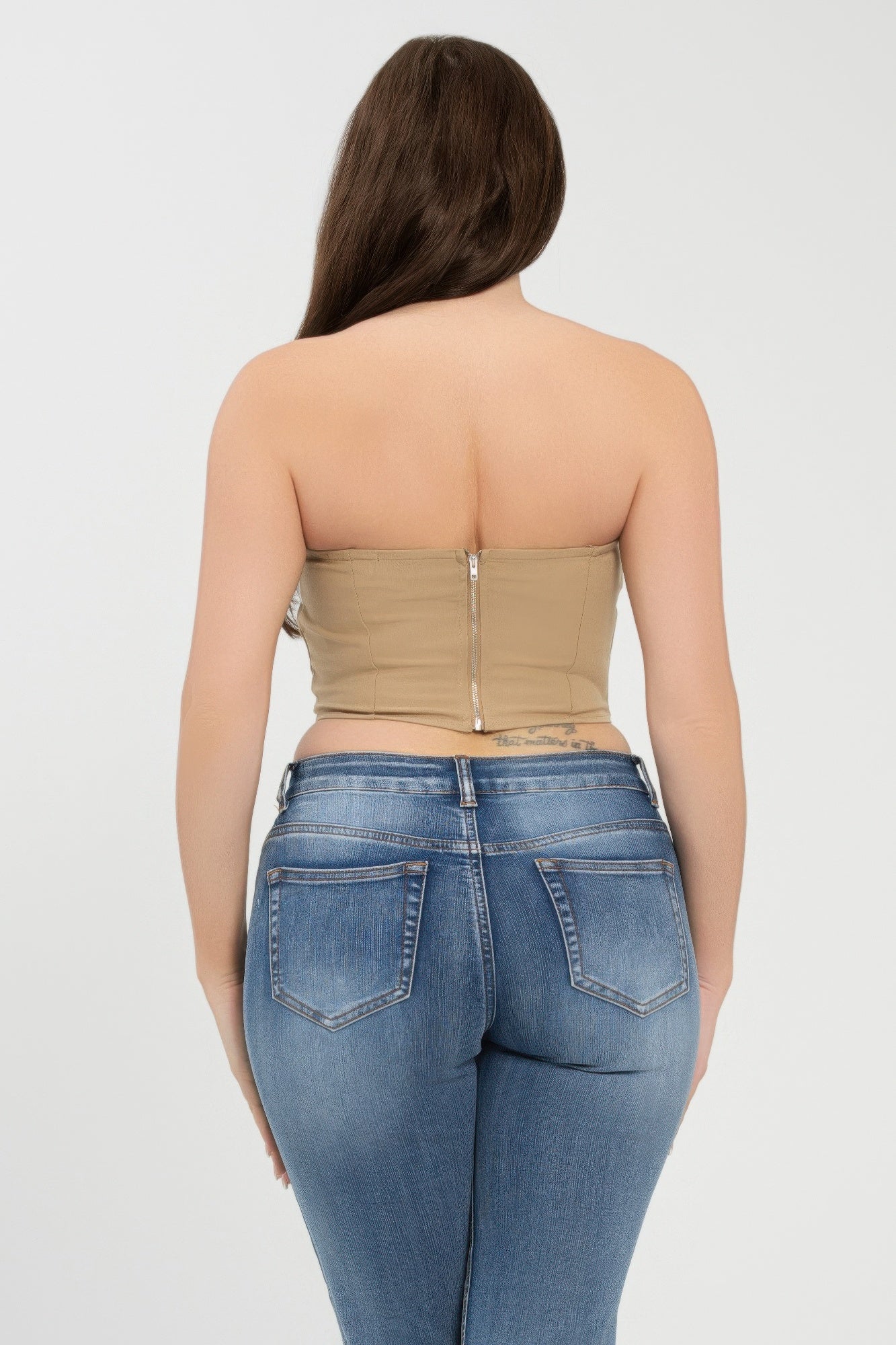Back view of khaki strapless tube top with vertical zipper seam