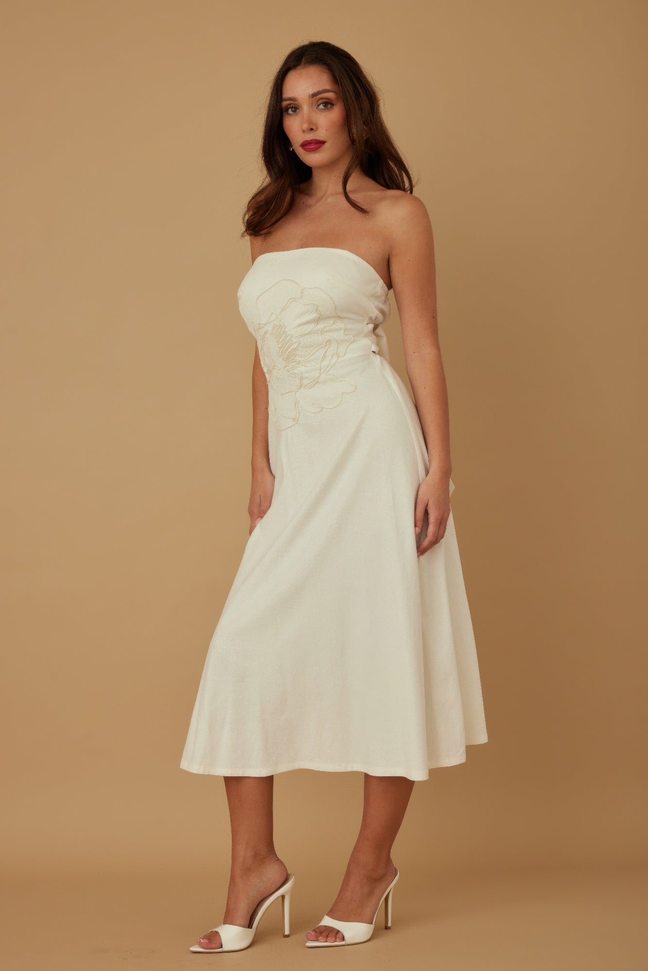 Ivory strapless linen midi dress with floral motif, fitted top and flared skirt