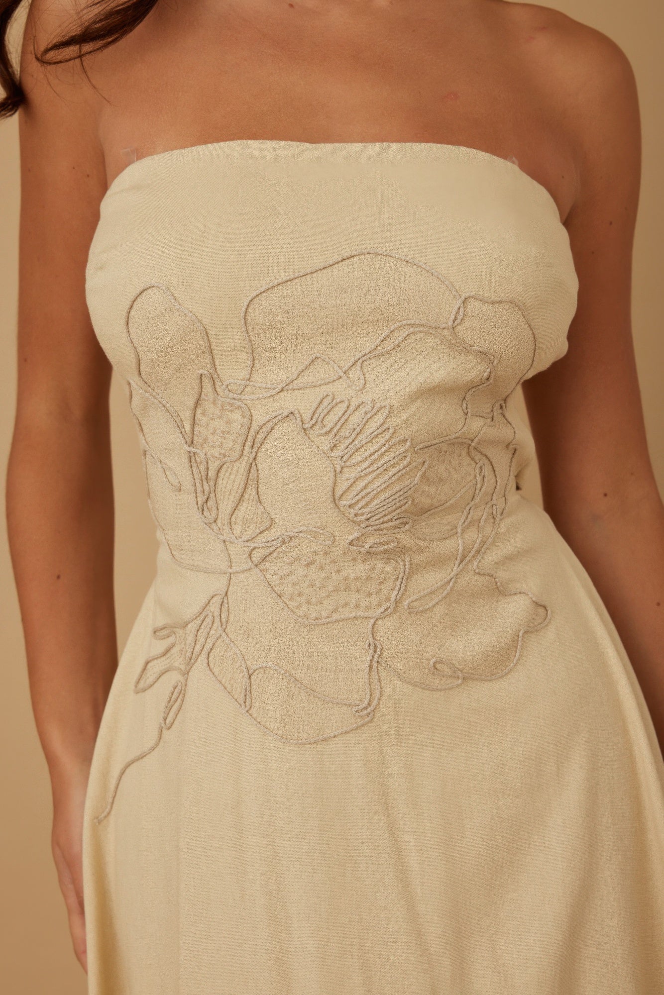 Ivory strapless linen dress with floral embroidery panel on fitted bodice