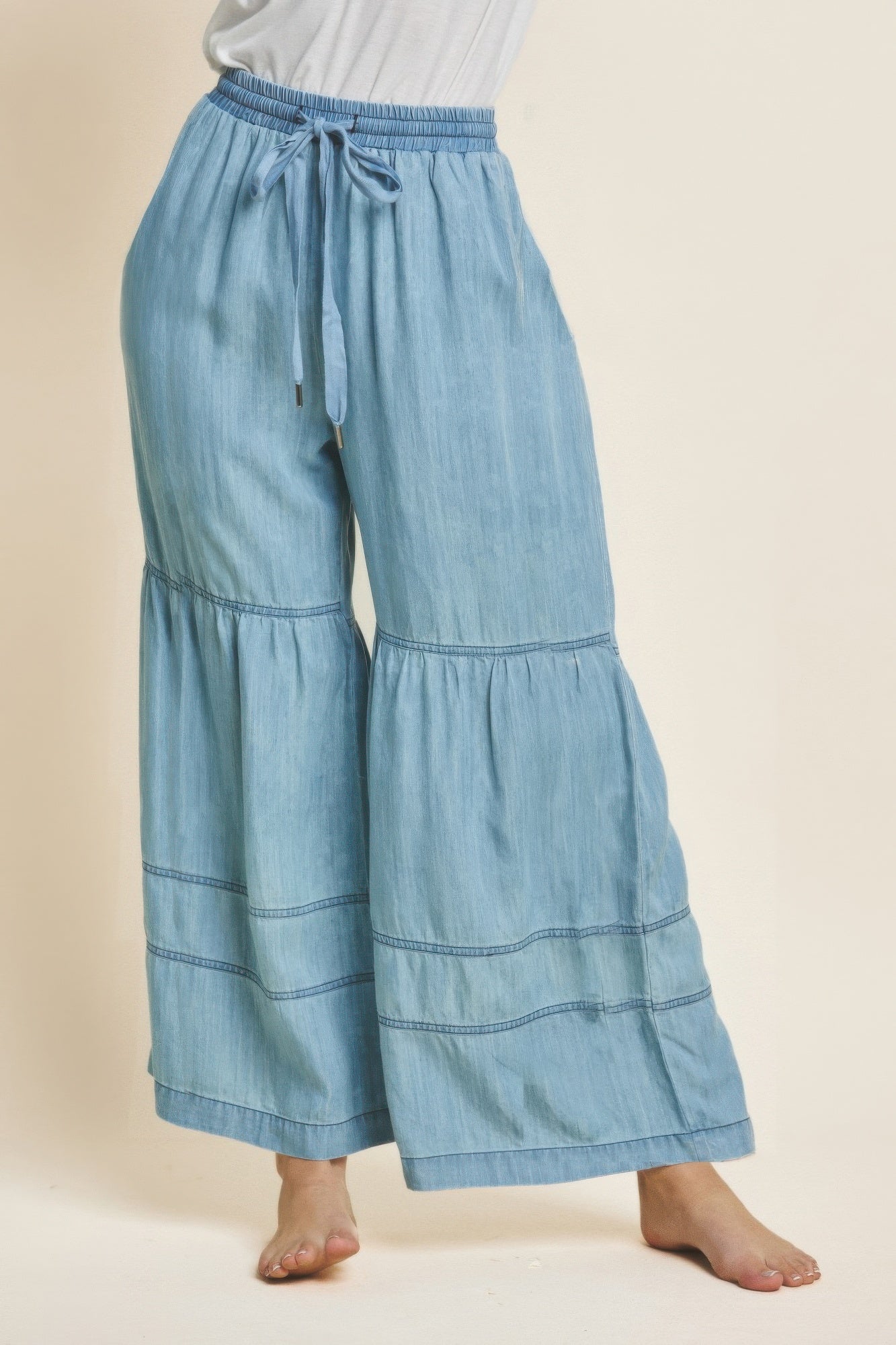 Washed denim tiered wide-leg pants, elastic waist with drawstring, light blue