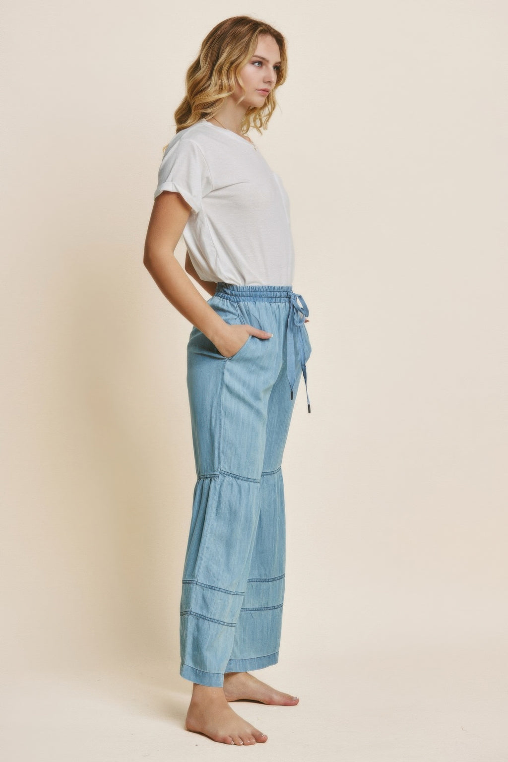 Washed denim tiered wide-leg pants, elastic waist with drawstring, side view