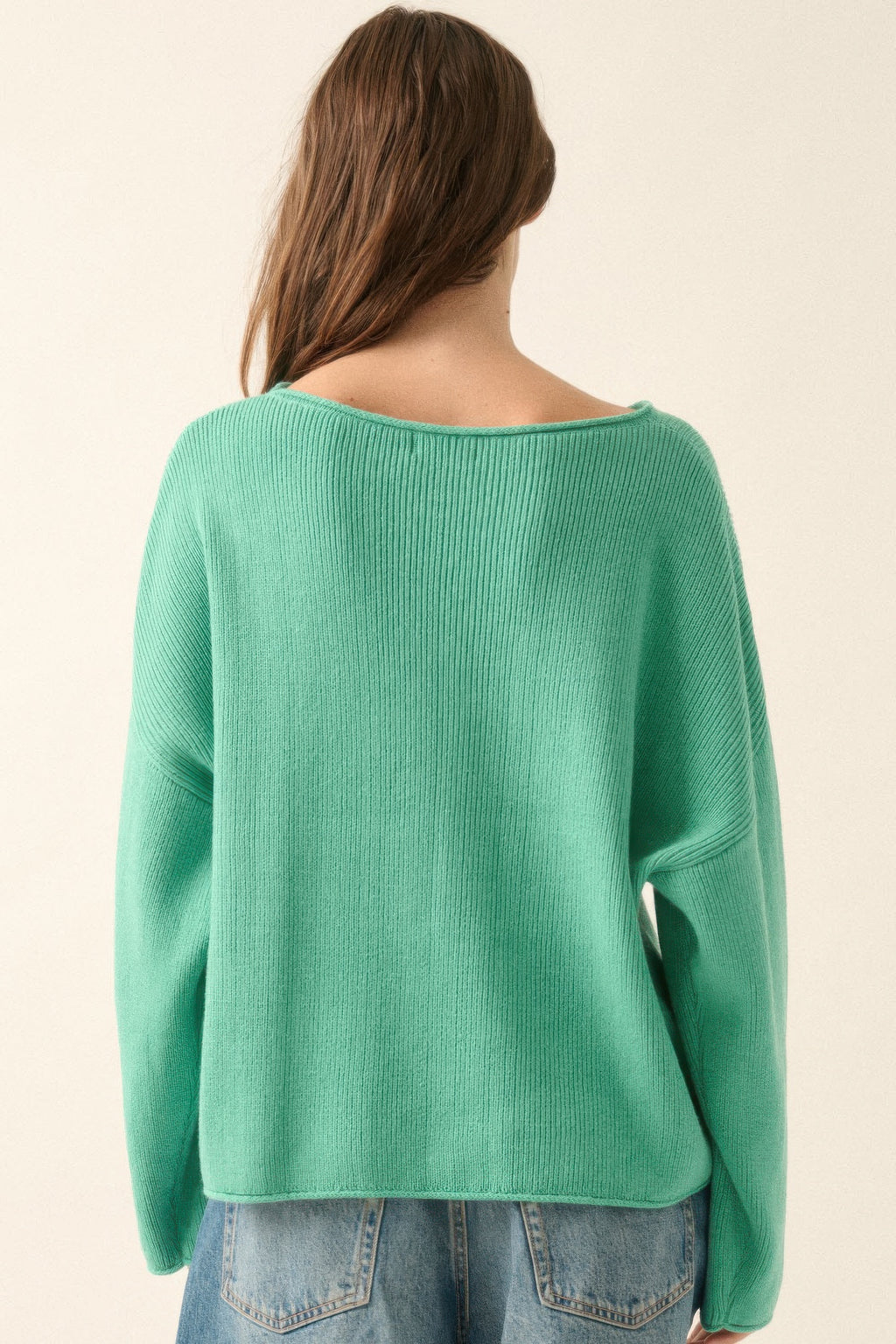 Back view of pine green oversized boatneck rib-knit sweater, plain knit texture