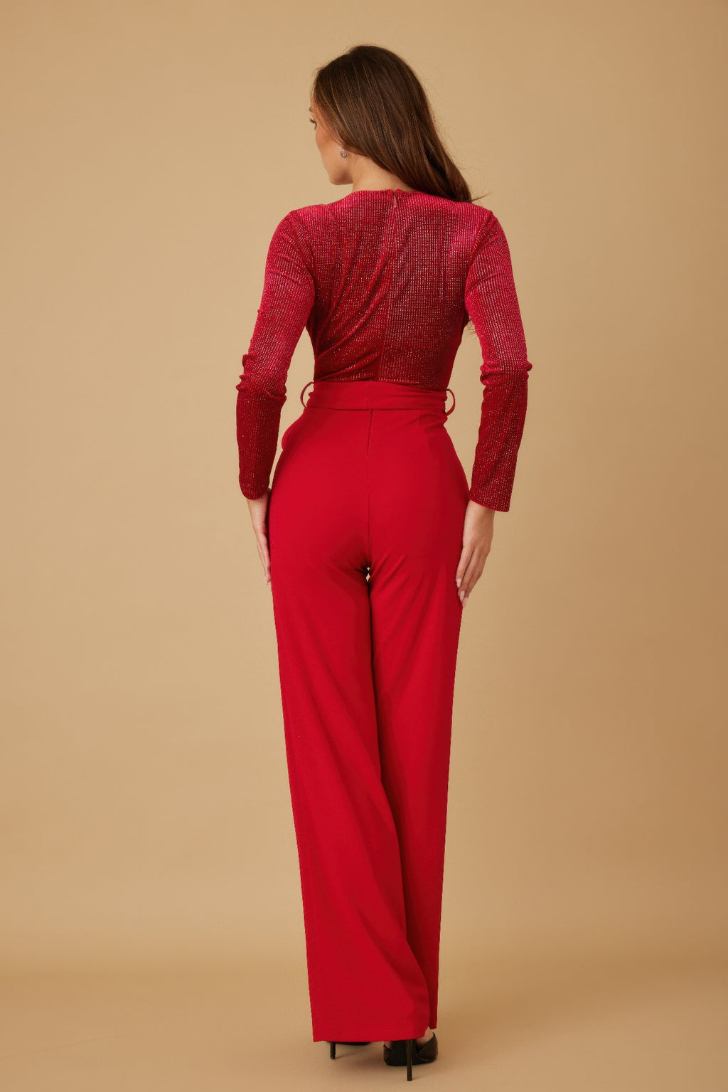 Red velvet top jumpsuit, back view with long sleeves and tied waist