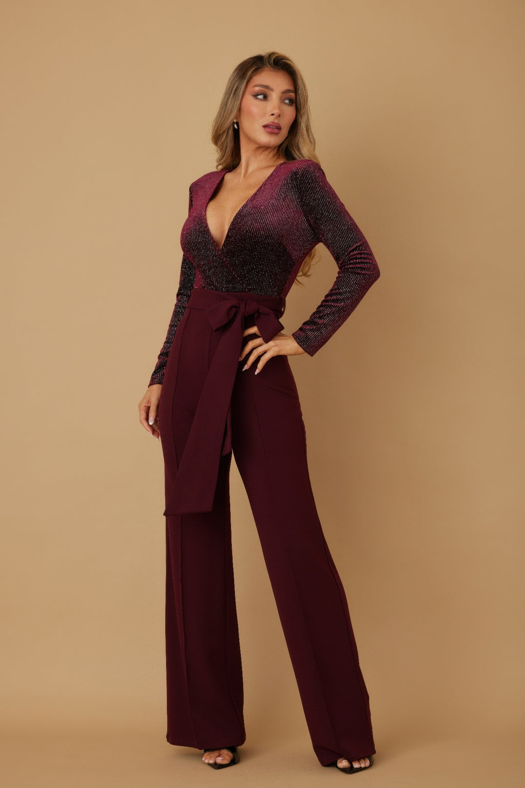 Wine velvet top fashion jumpsuit, side view with long sleeves and waist tie