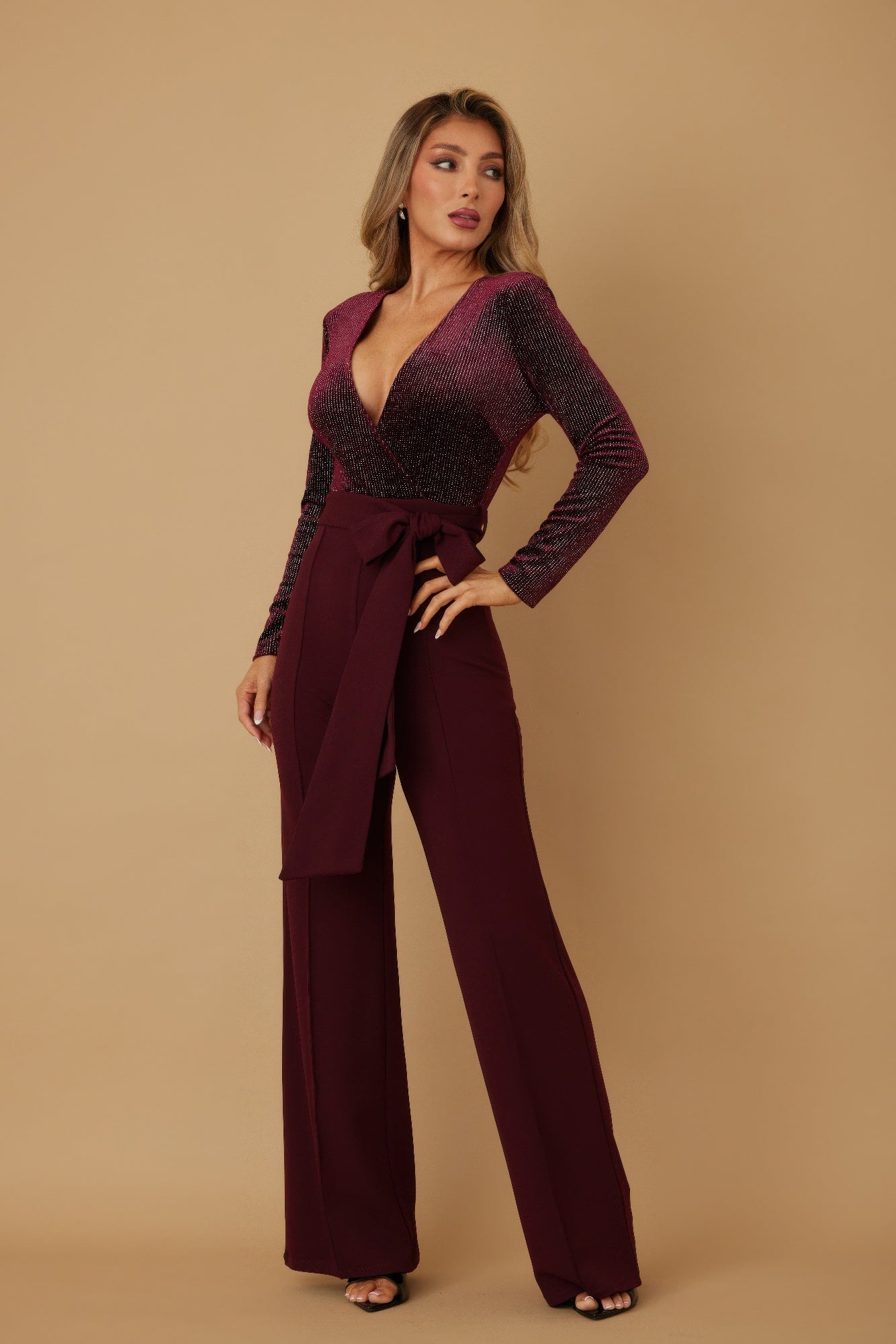 Wine velvet top fashion jumpsuit, side view with long sleeves and waist tie