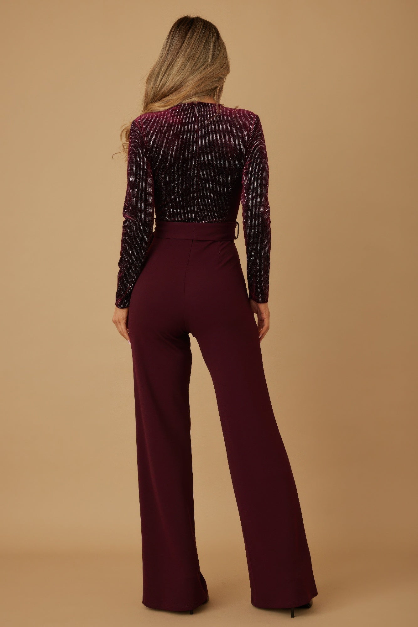Wine velvet top fashion jumpsuit, back view with long sleeves and wide-leg pants