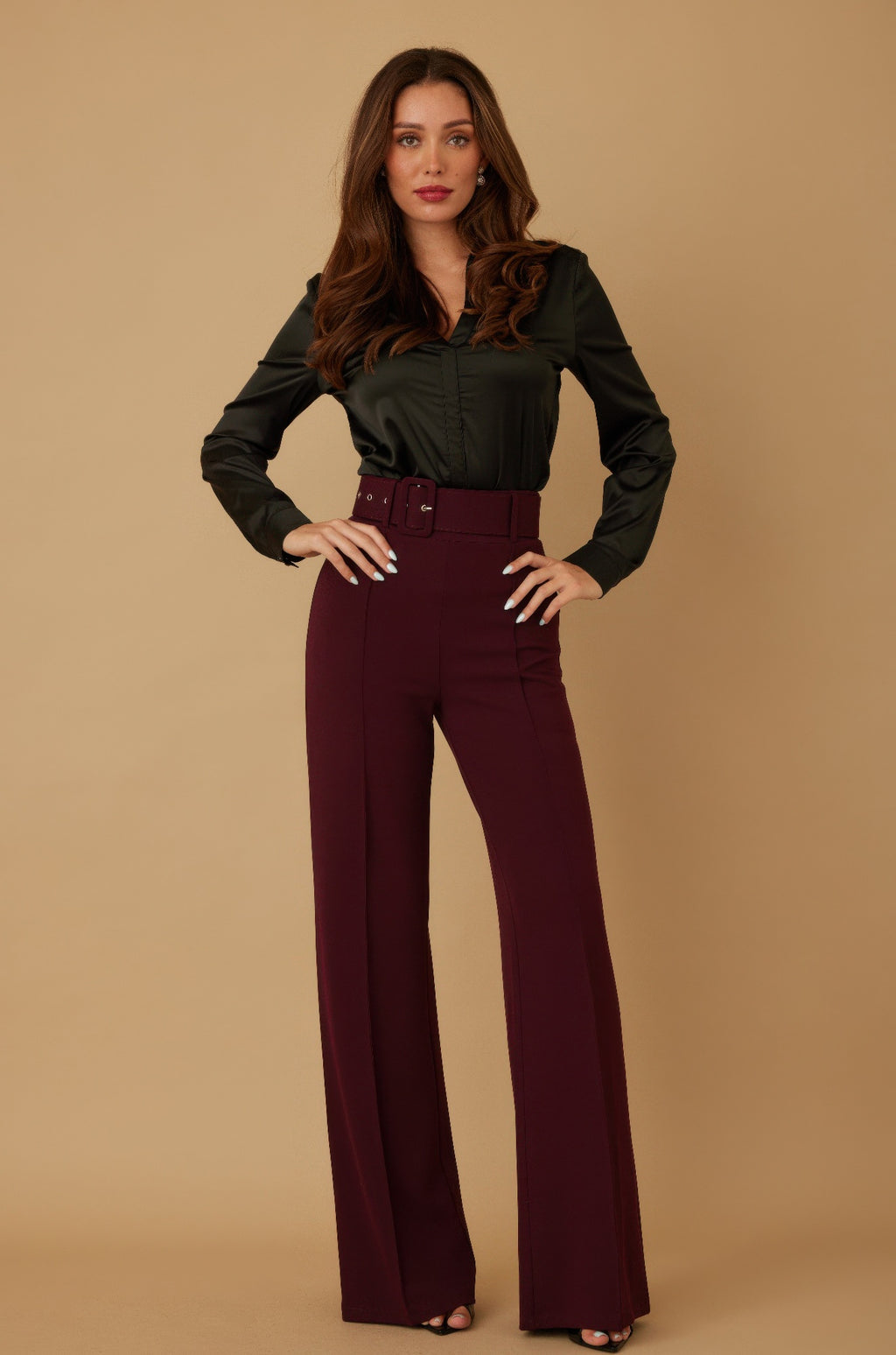Wine-colored high-waist pants with buckle belt and wide flared legs.