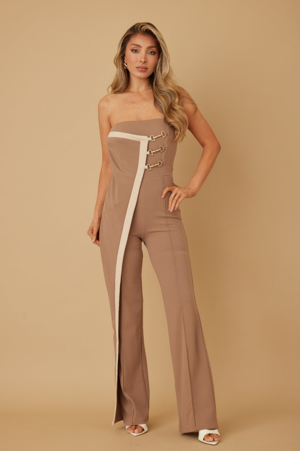 Taupe strapless jumpsuit with white panel, gold chain trim, front leg split
