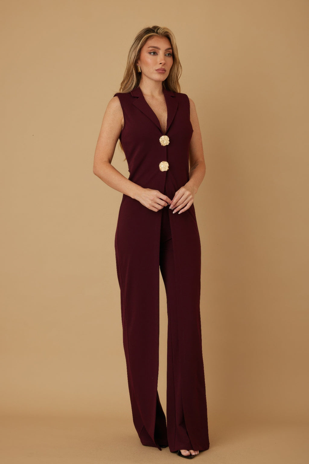 Wine sleeveless jumpsuit with open flap front and wide-leg trousers, gold buttons