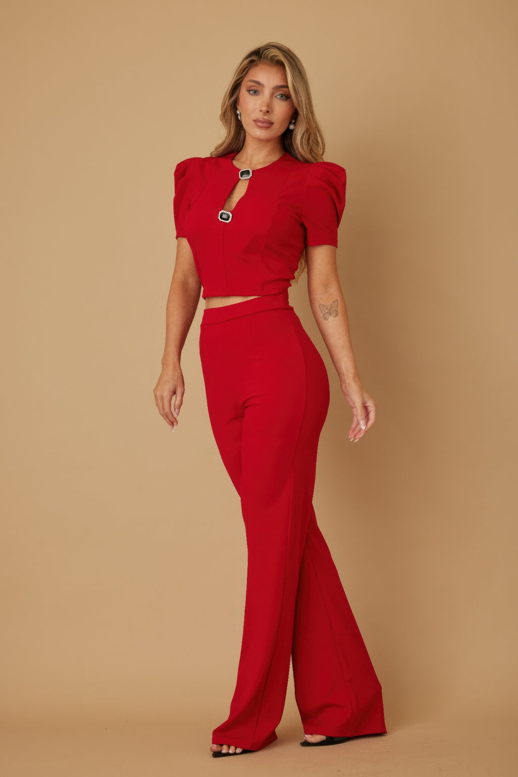 Red matching crop top and wide-leg pants set with puff cap sleeves and jewel detail