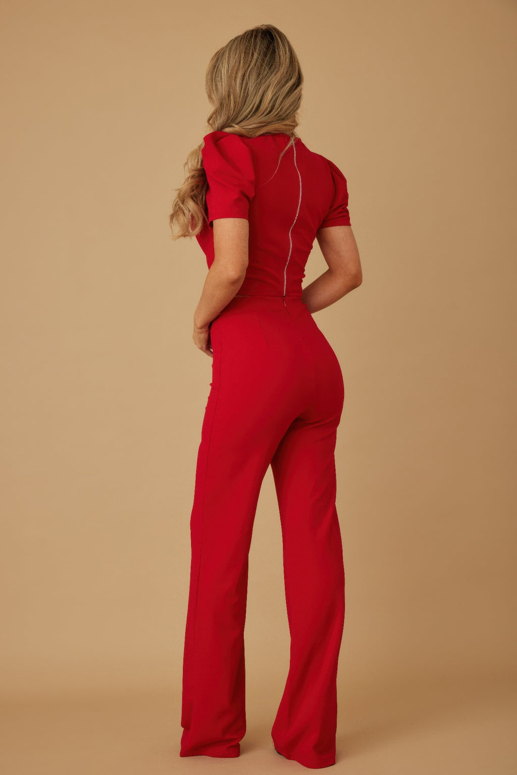 Back view of red matching set: puff cap sleeve crop top and wide-leg pants