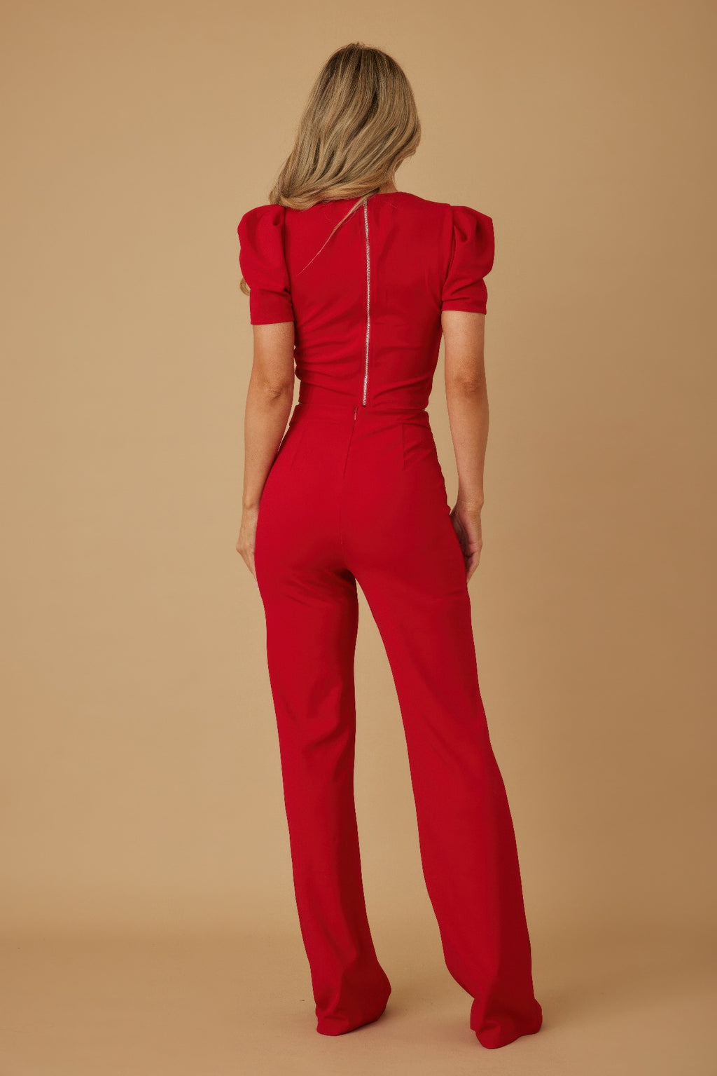 Back view of red two-piece set with center-back seam on crop top and pants