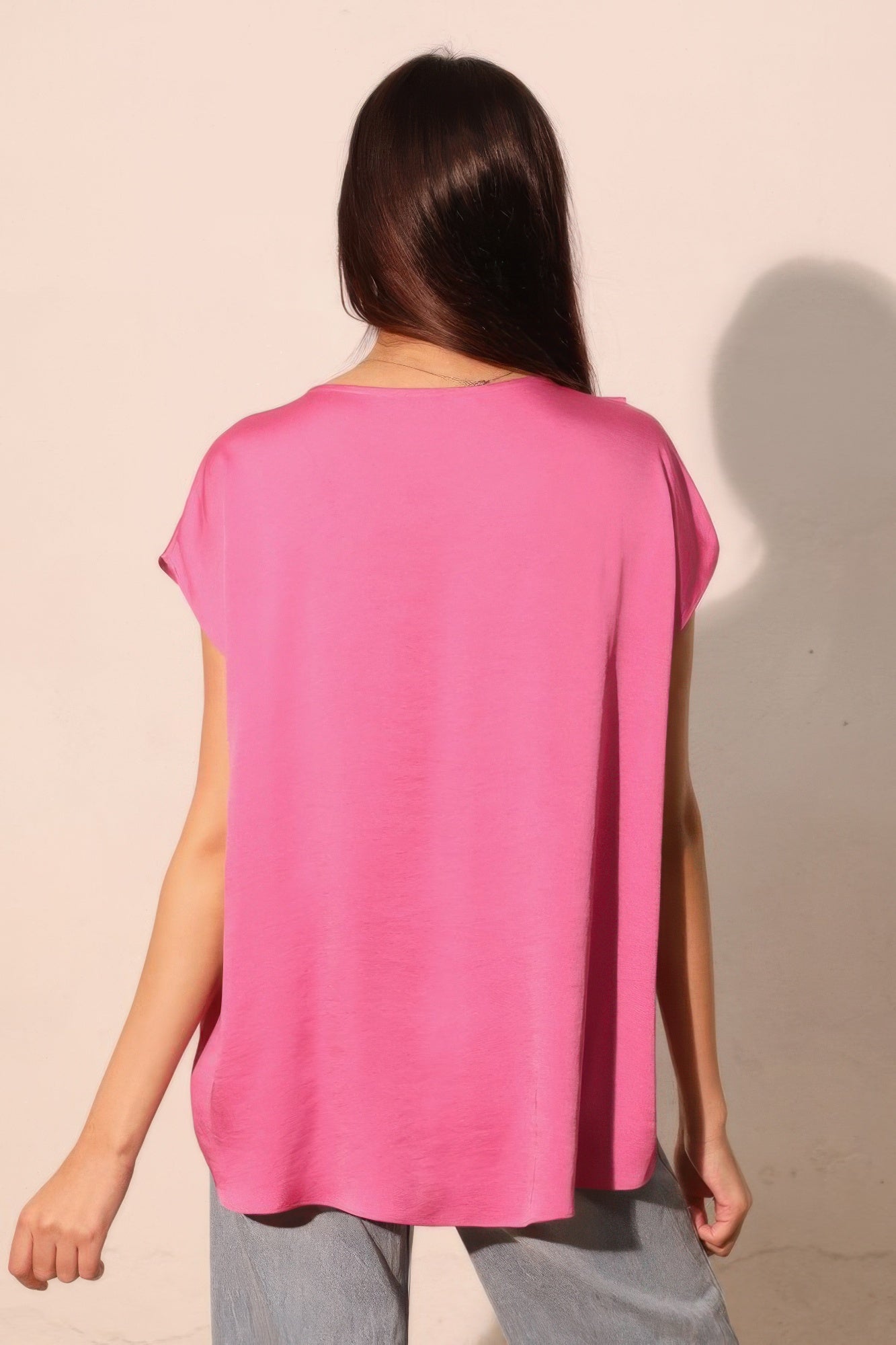 Pink tulip tunic top, back view, short sleeves and curved tulip hem