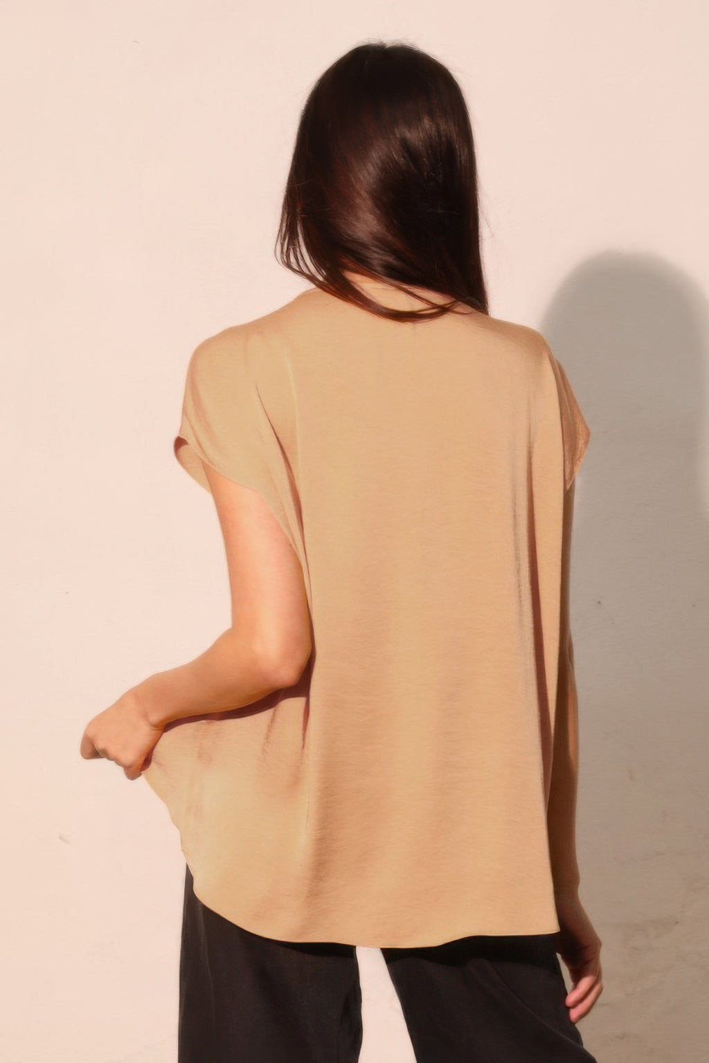 Tan tulip tunic top with short sleeves and curved back hem