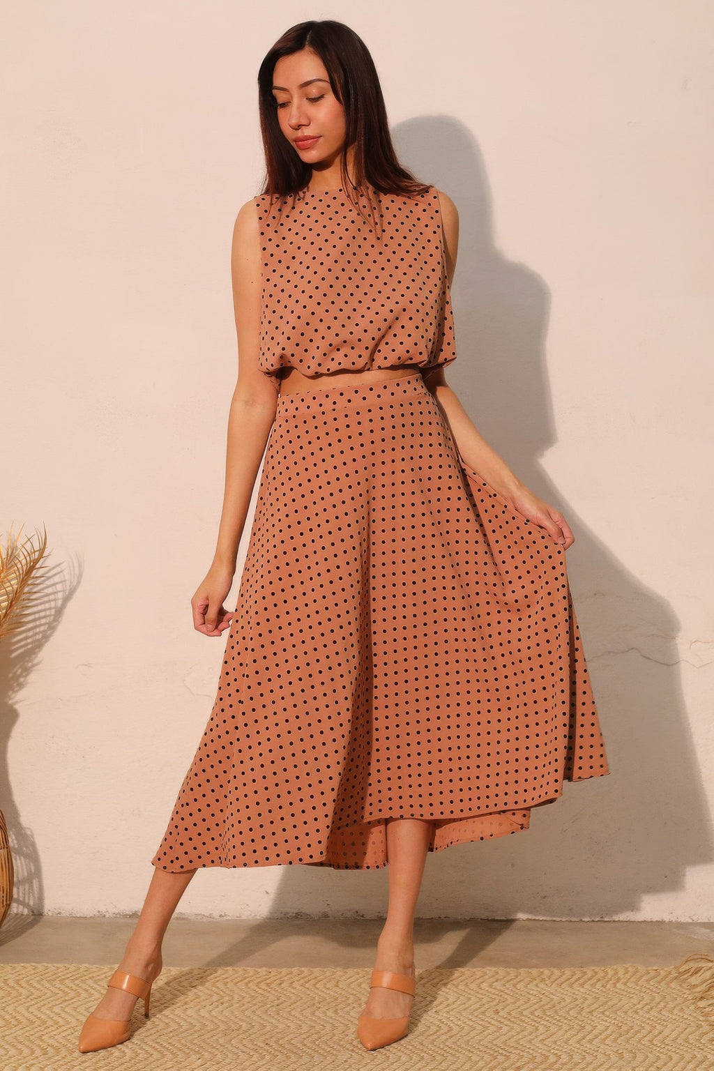 Flocked polka dot bubble crop top with sleeveless silhouette and straight hem