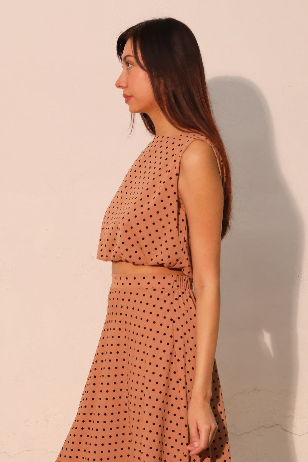 Flocked polka dot sleeveless crop top with bubble hem detail and high neck