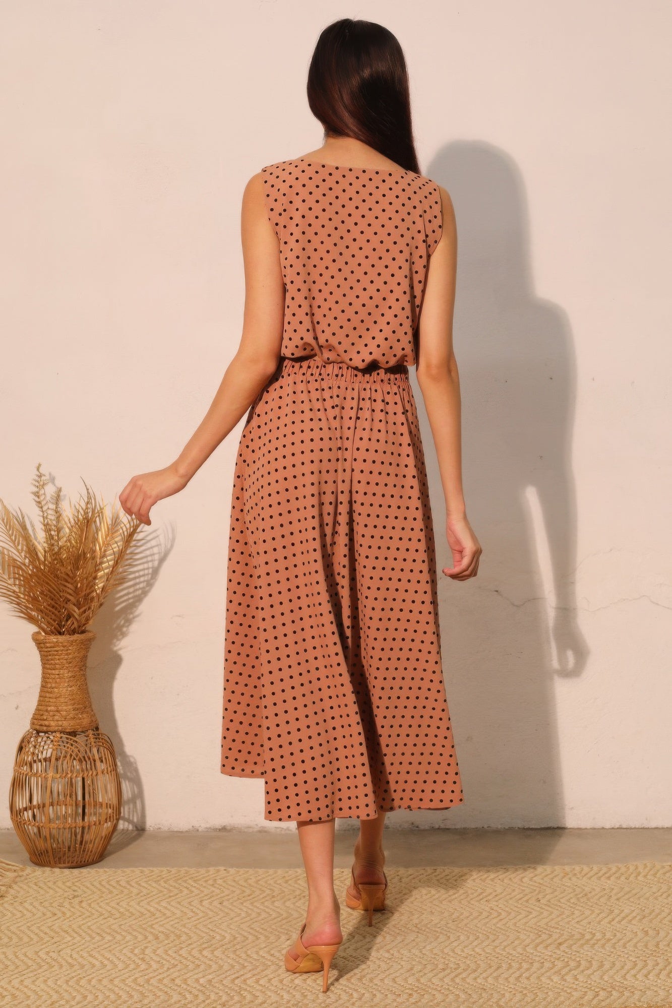 Flocked polka dot bubble crop top from behind, sleeveless with back tie detail