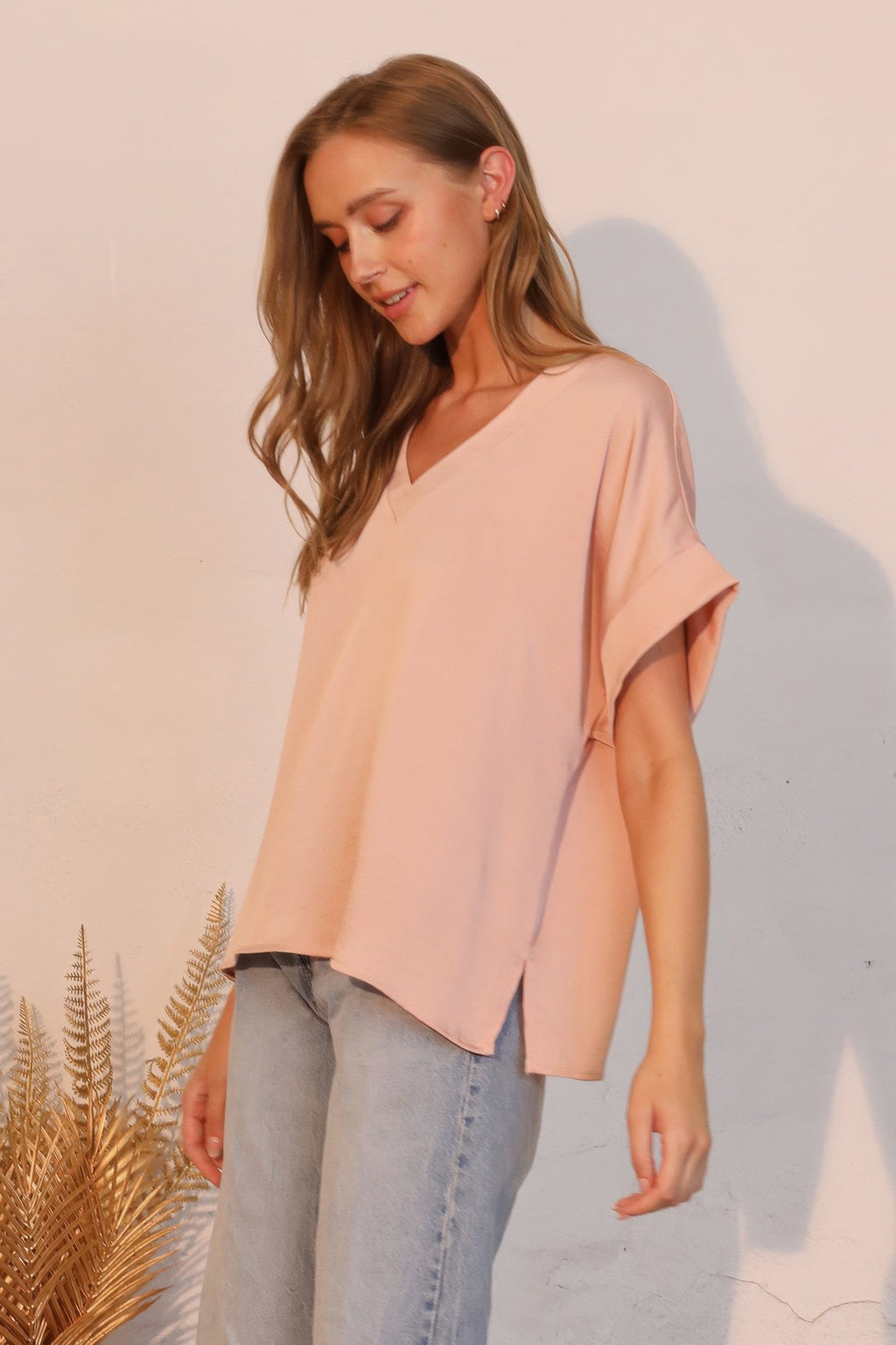 Rose champagne V-neck washed poly-silk tee, short sleeves, side view