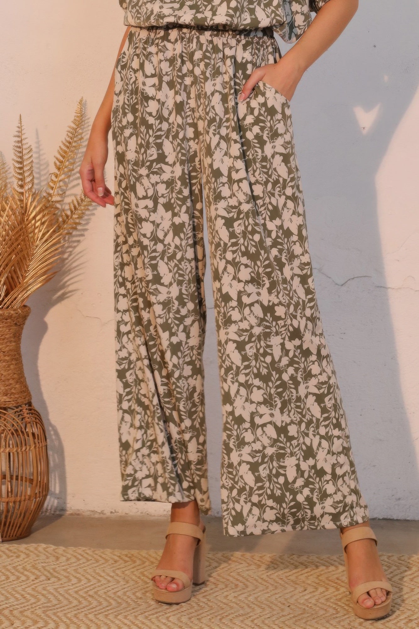 Olive floral pocket pants with wide-leg drape and elastic waistband