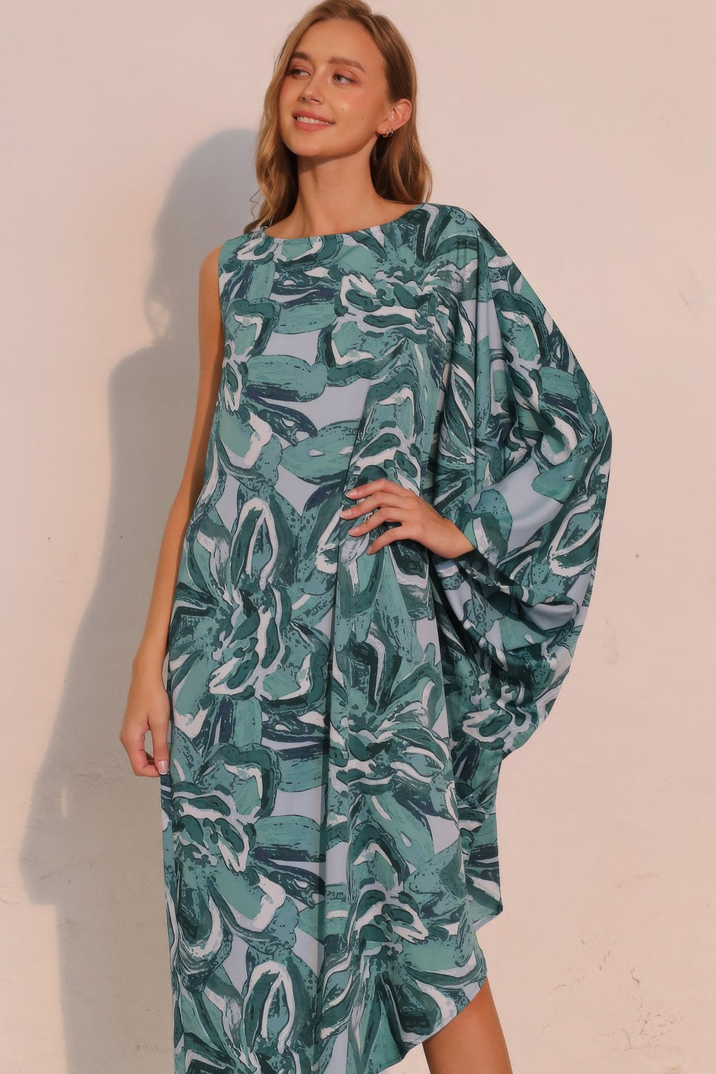 Petal print one-sleeve dress, teal, neckline and flowing drape sleeve detail