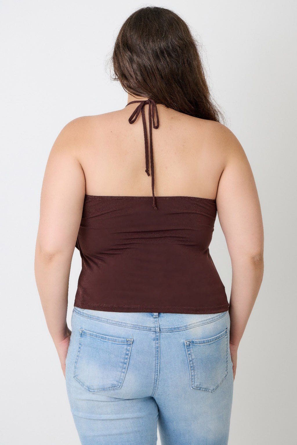Back view of brown halter draped top with tie at upper back and keyhole front