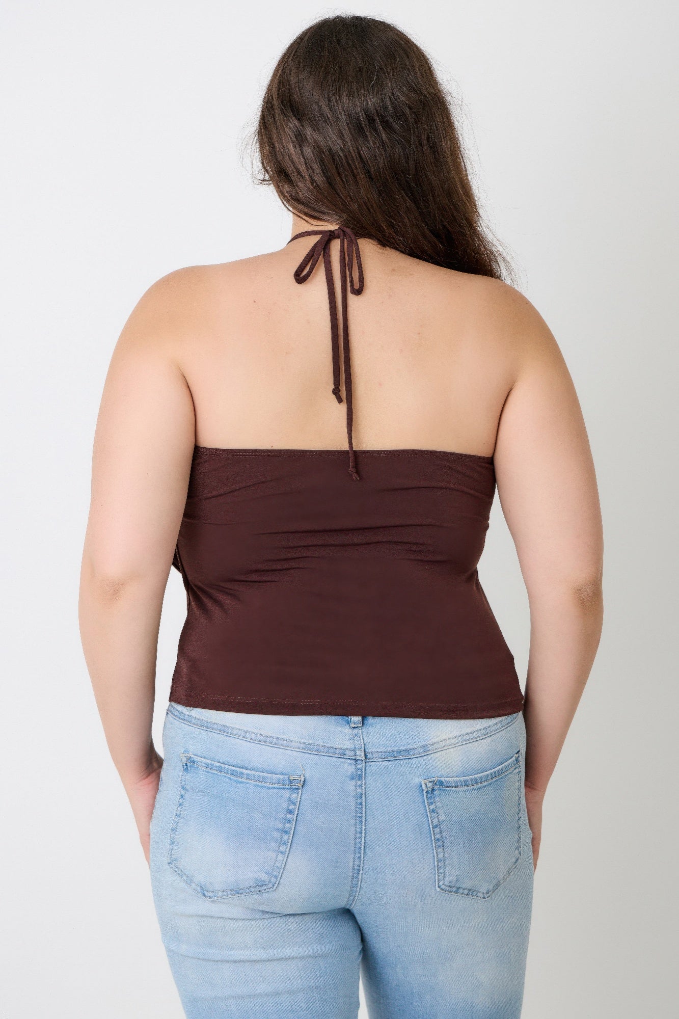 Back view of brown halter draped top with tie at upper back and keyhole front