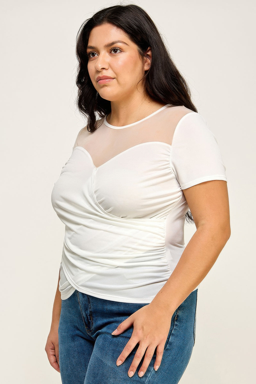 White mesh wrap top with V neckline, gathered crossover front, short sleeves
