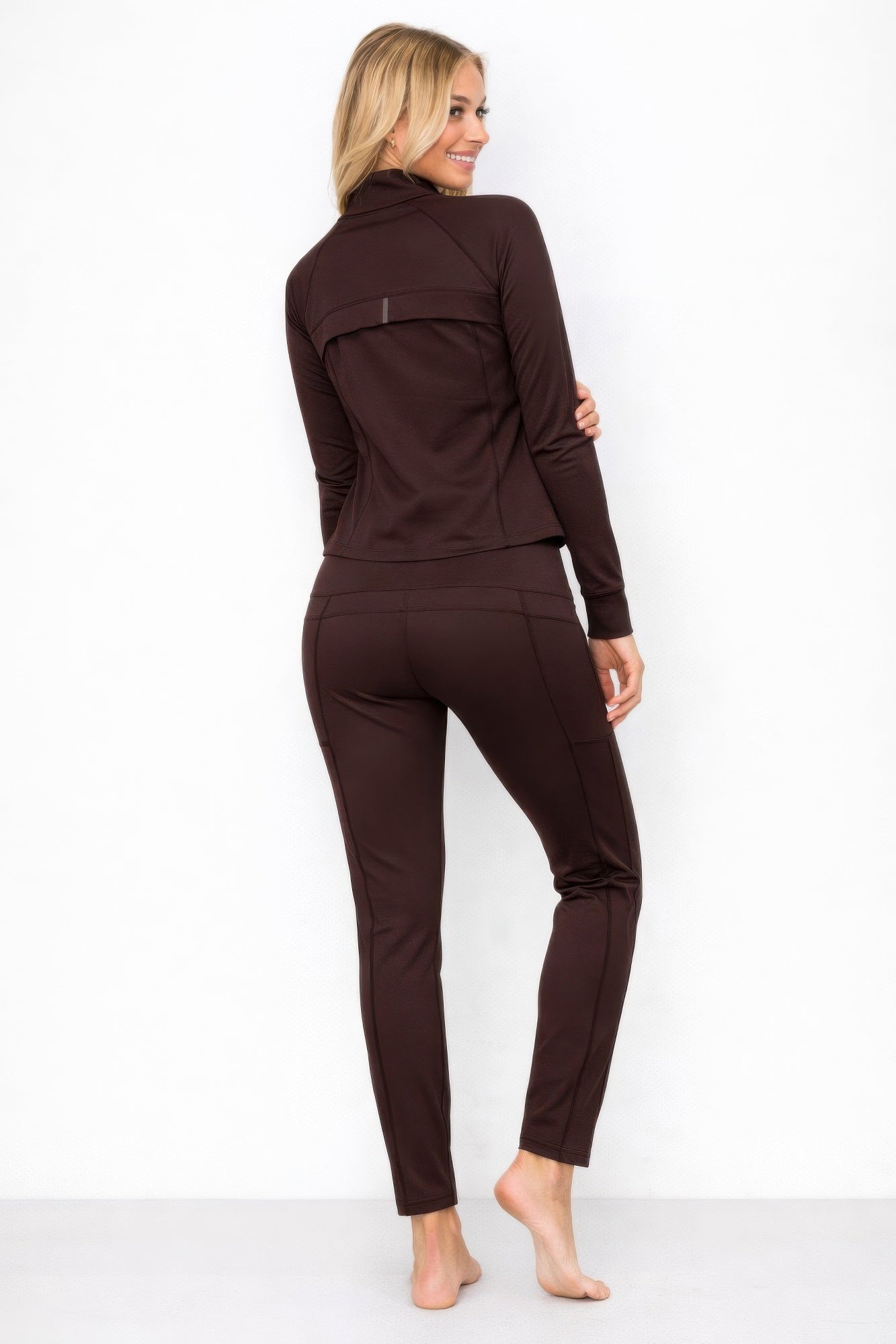 Brown zip-up athletic jacket and matching lounge pants, side/back view