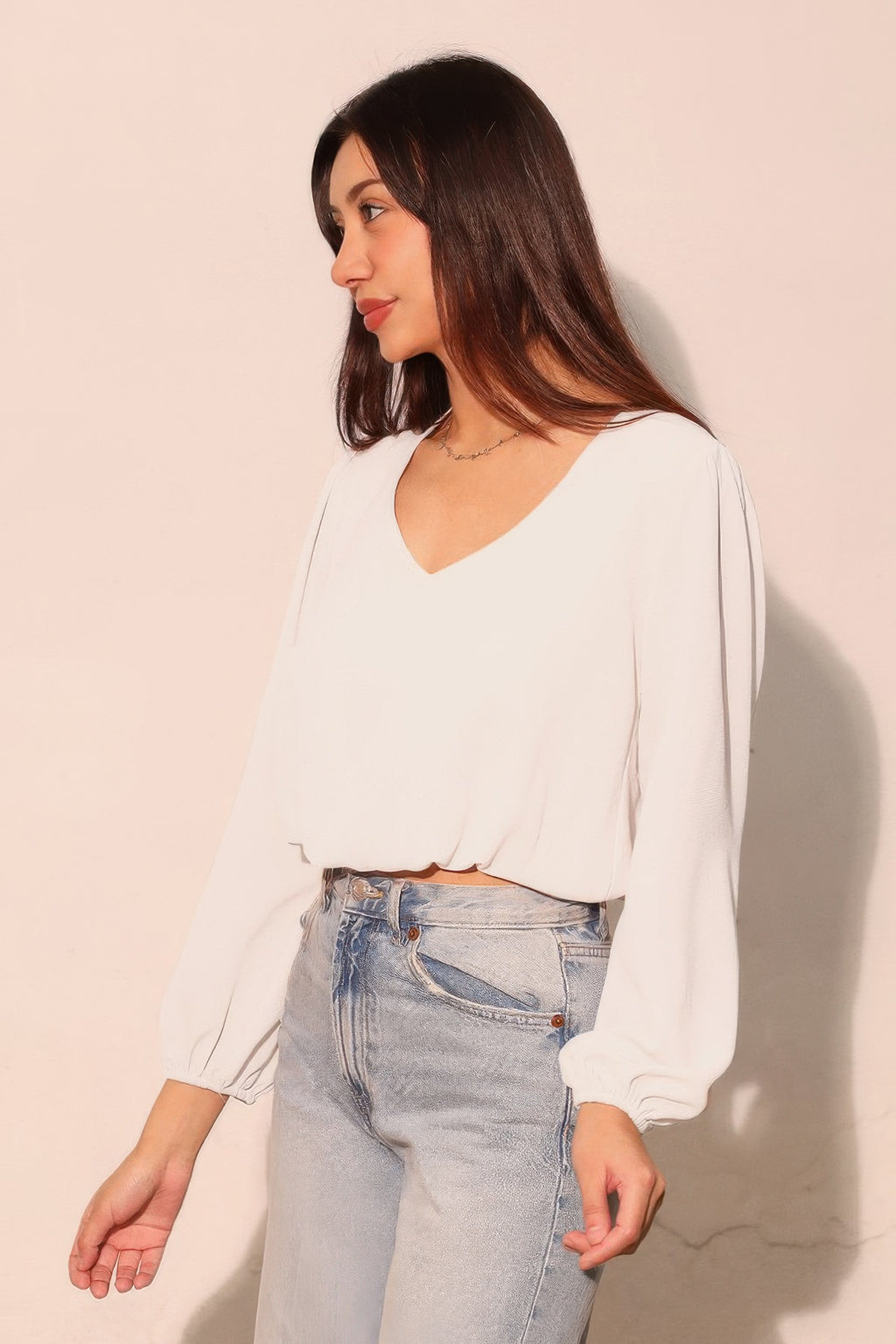 White V-neck textured crop top, relaxed fit with long balloon sleeves