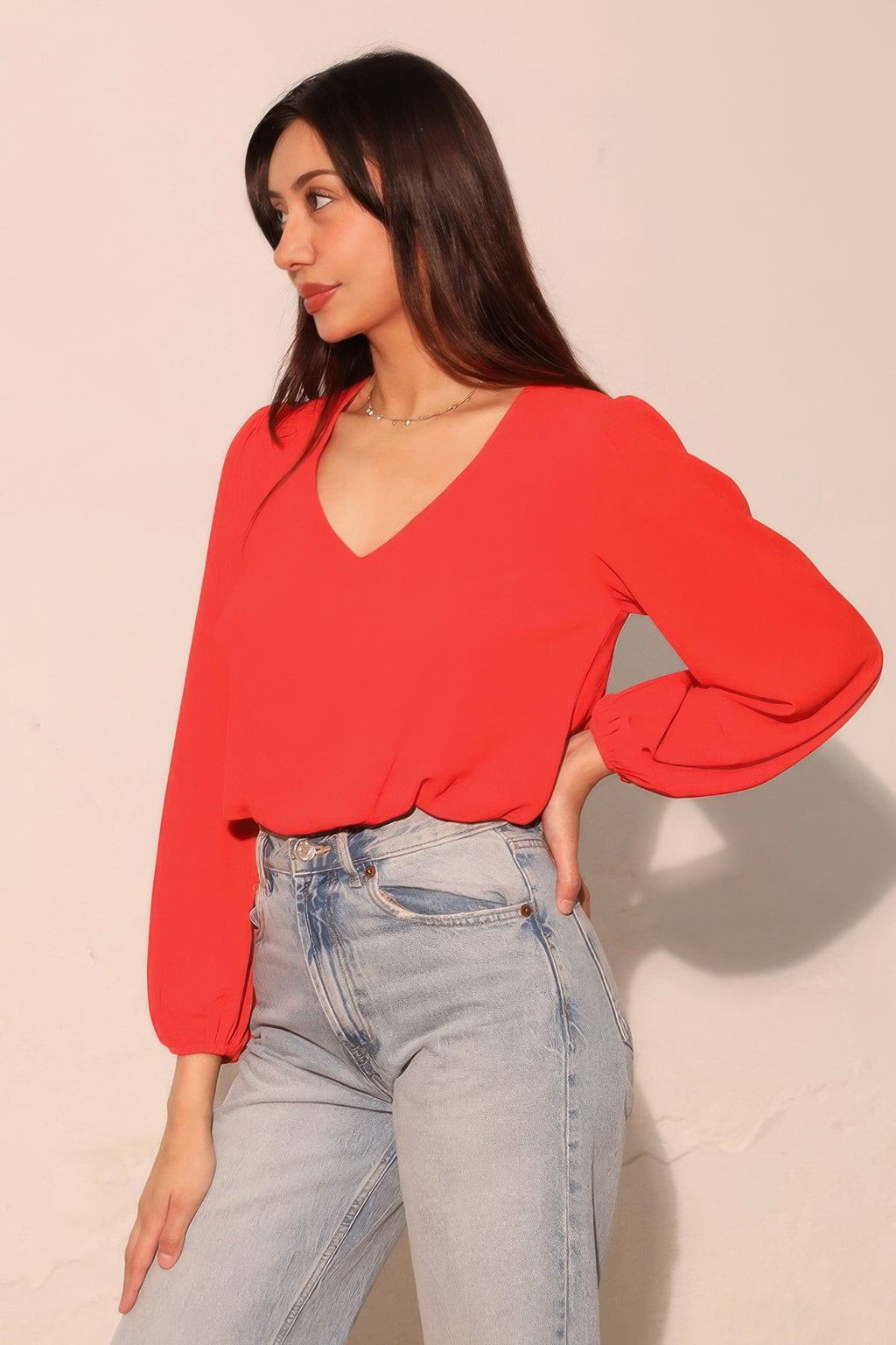 Tomato red V-neck textured crop top with voluminous long balloon sleeves and cuffs