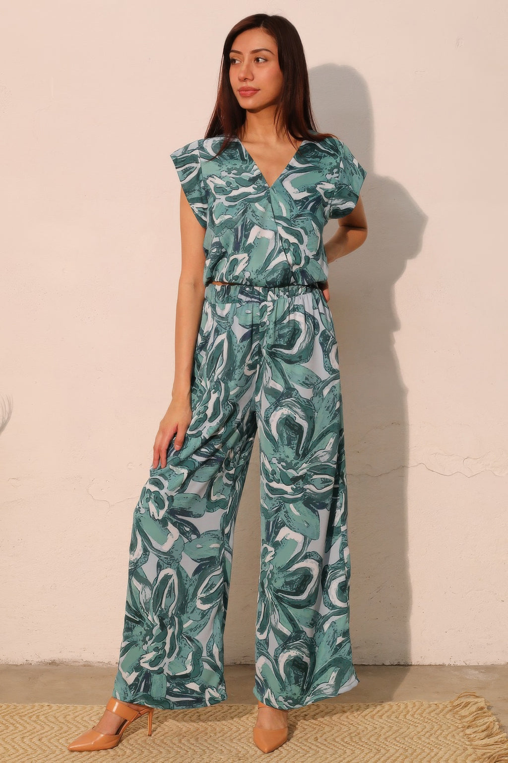 Teal floral print pocket pants with wide legs and elastic waistband
