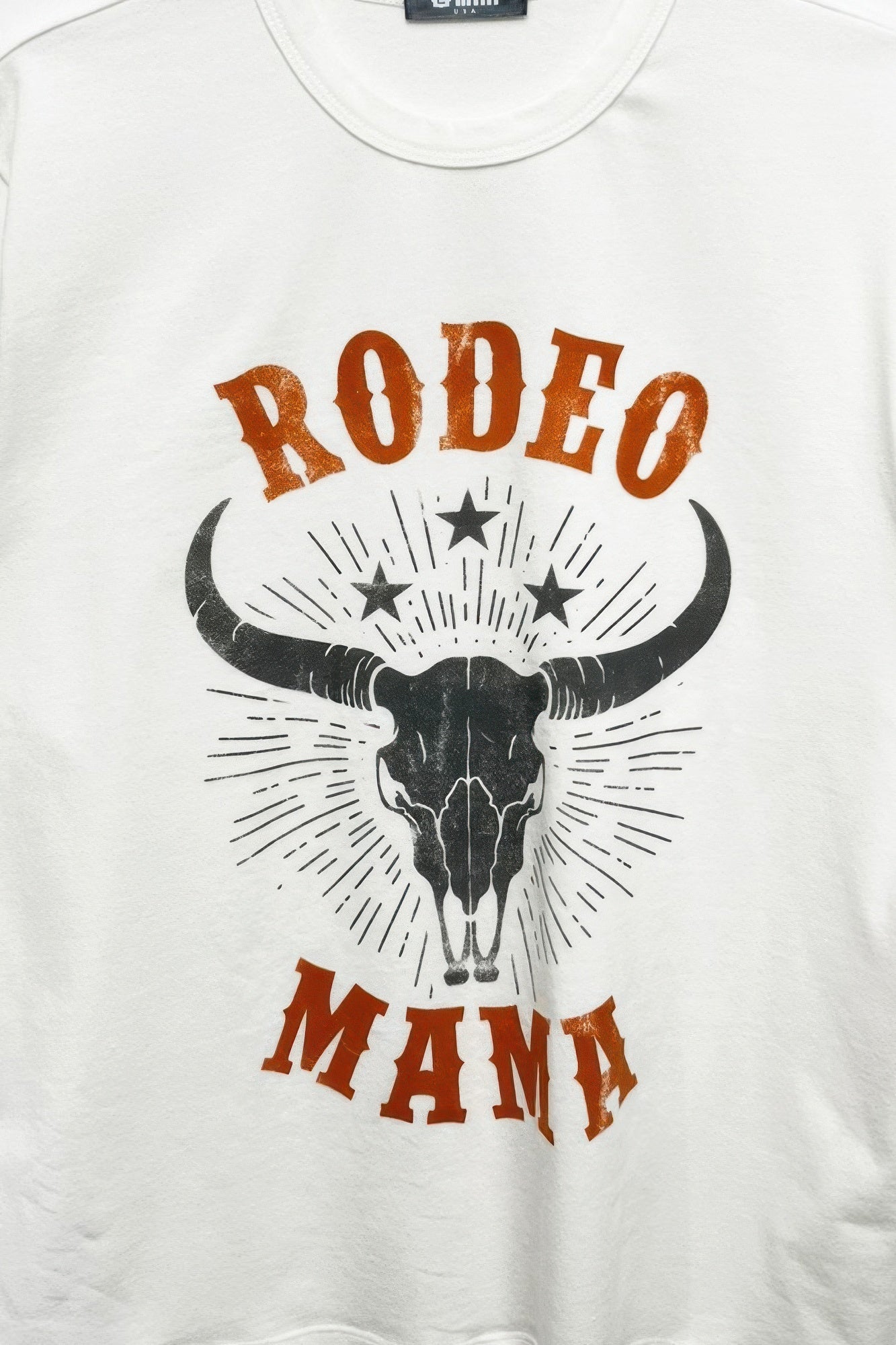 Rodeo Mama graphic print T-shirt front, bull head with stars in brown and black
