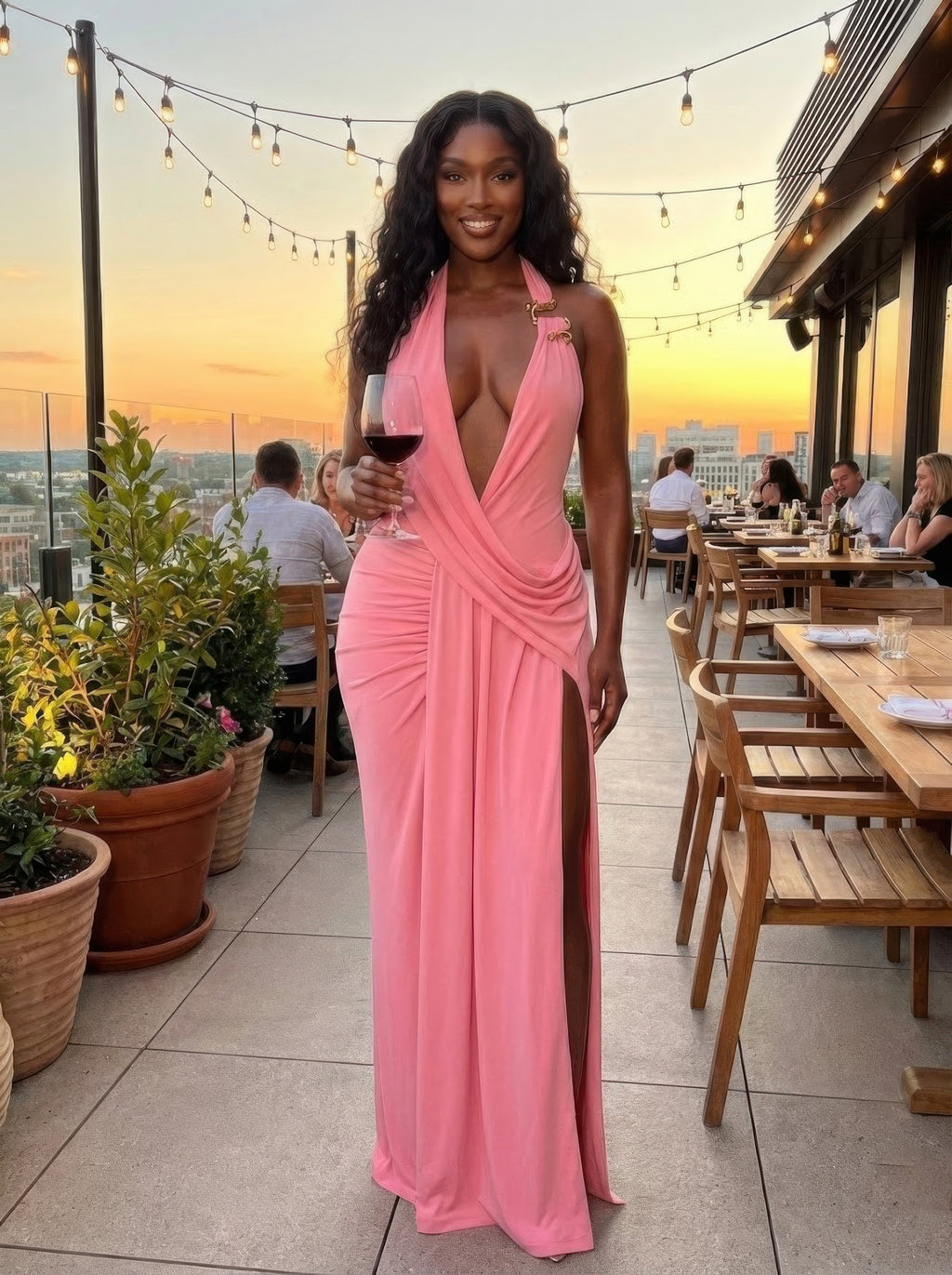 Bubble gum pink halter maxi dress with deep V neckline and wrap-style drape
