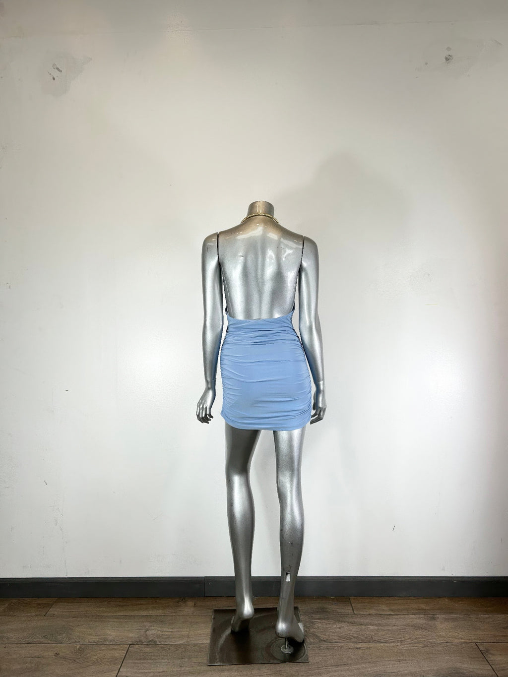 Light blue mini dress with draped cowl neckline and ruched body, back view