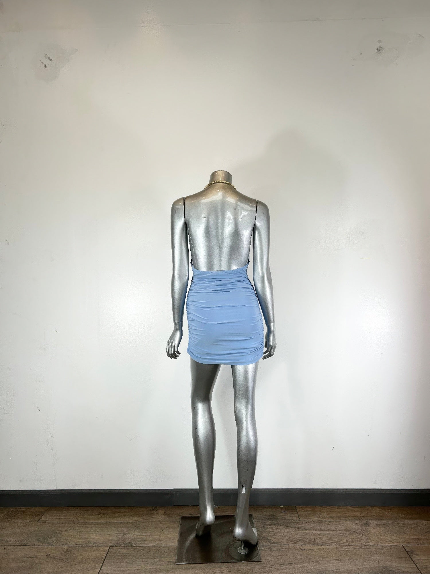 Light blue mini dress with draped cowl neckline and ruched body, back view