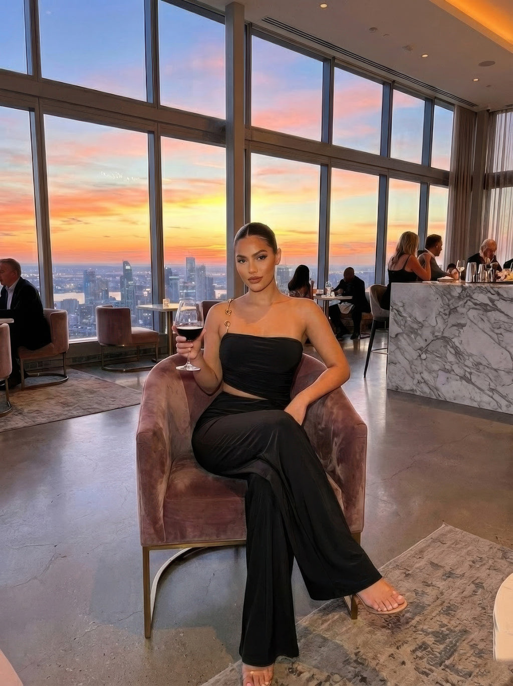 Black ruched bandeau jumpsuit, strapless crop bodice and flared wide legs