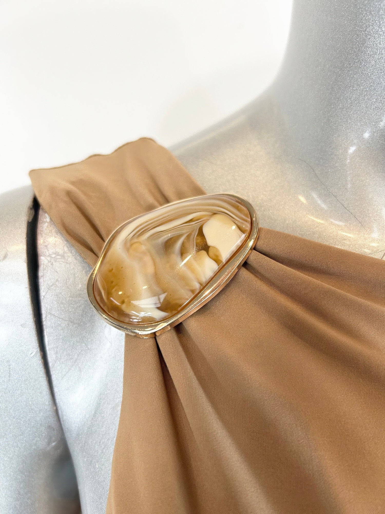 Camel mini dress close-up showing gathered right-shoulder detail