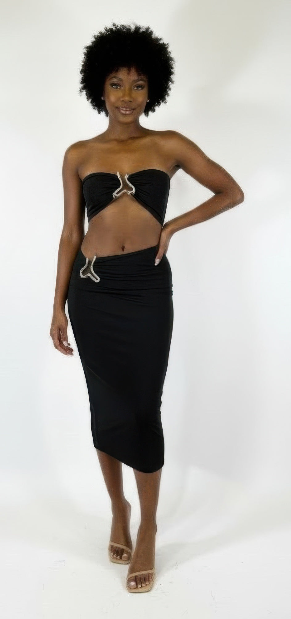Black midi bodycon dress with strapless triangular cutout bust and draped waist detail