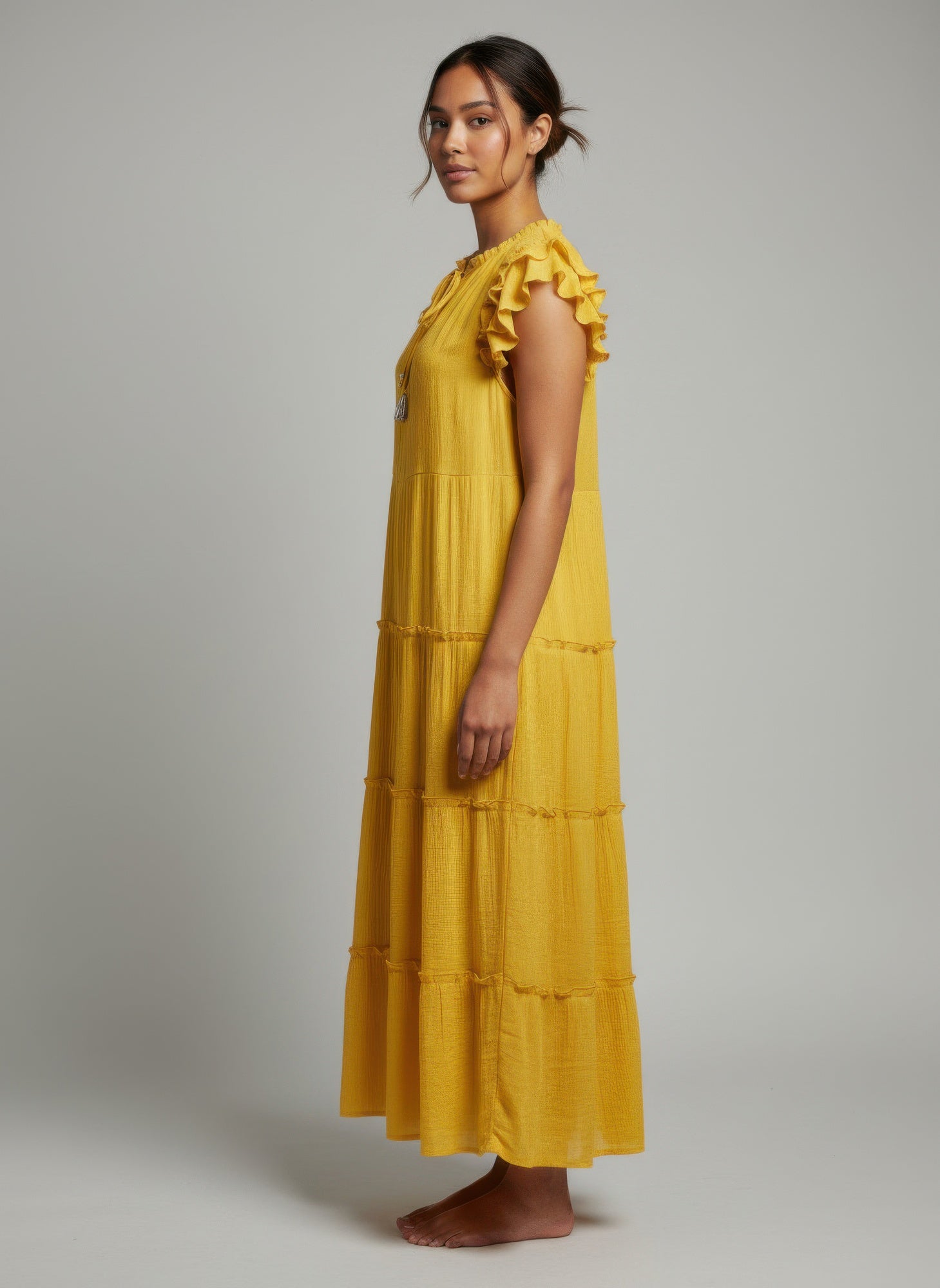 Solid lemon cap-sleeve tiered dress, ruffled shoulder detail, side view