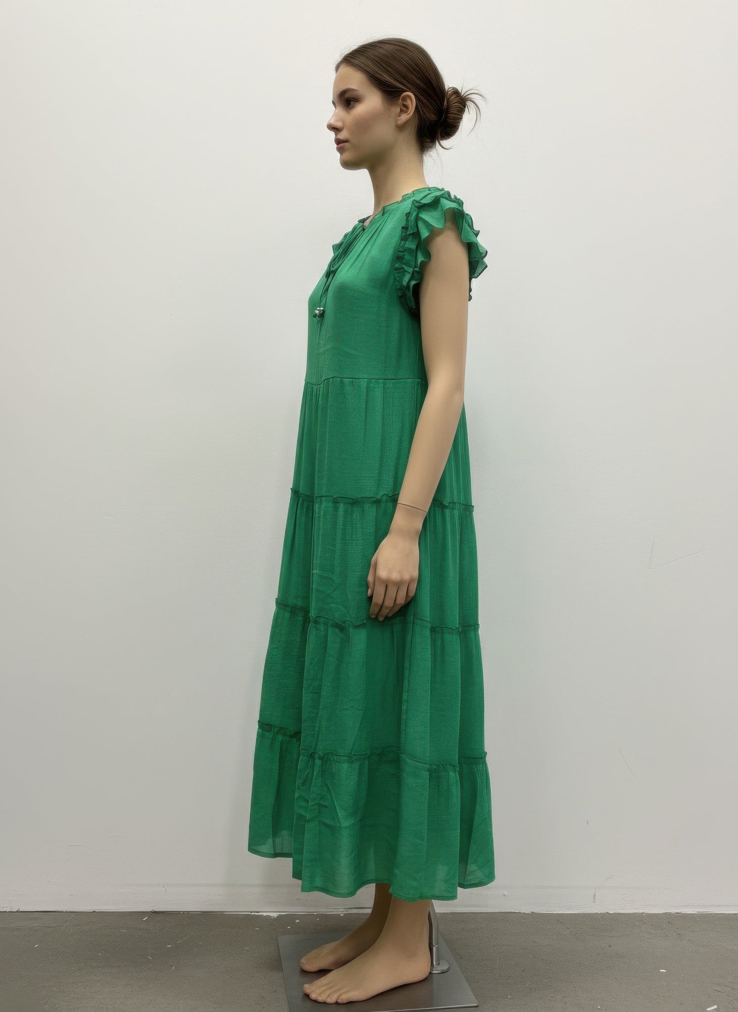 Solid green cap-sleeve tiered dress, ruffled shoulder detail, side view