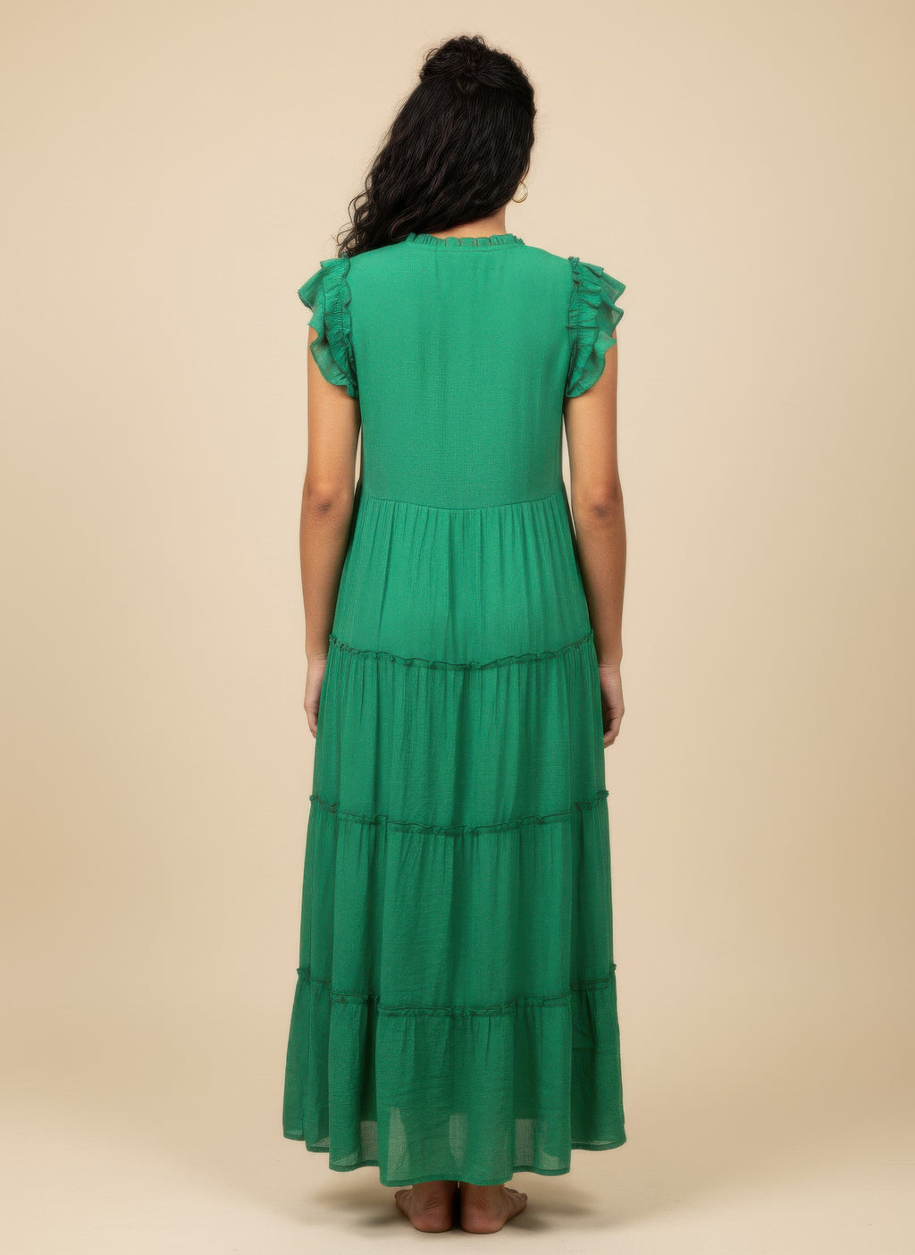 Solid green cap-sleeve tiered dress, back view, tiered skirt tiers