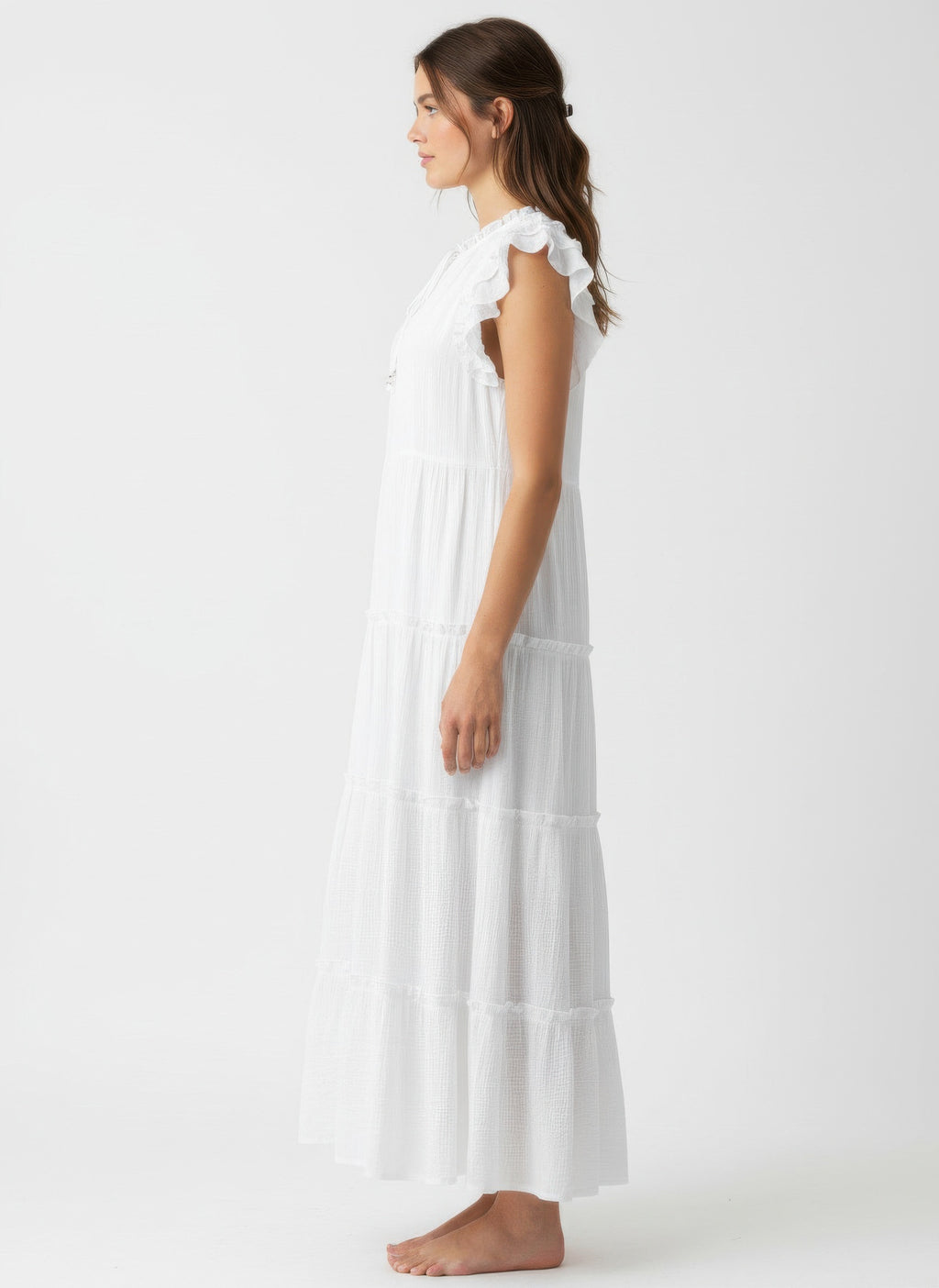 Solid white cap-sleeve tiered dress, ruffled sleeves, side view