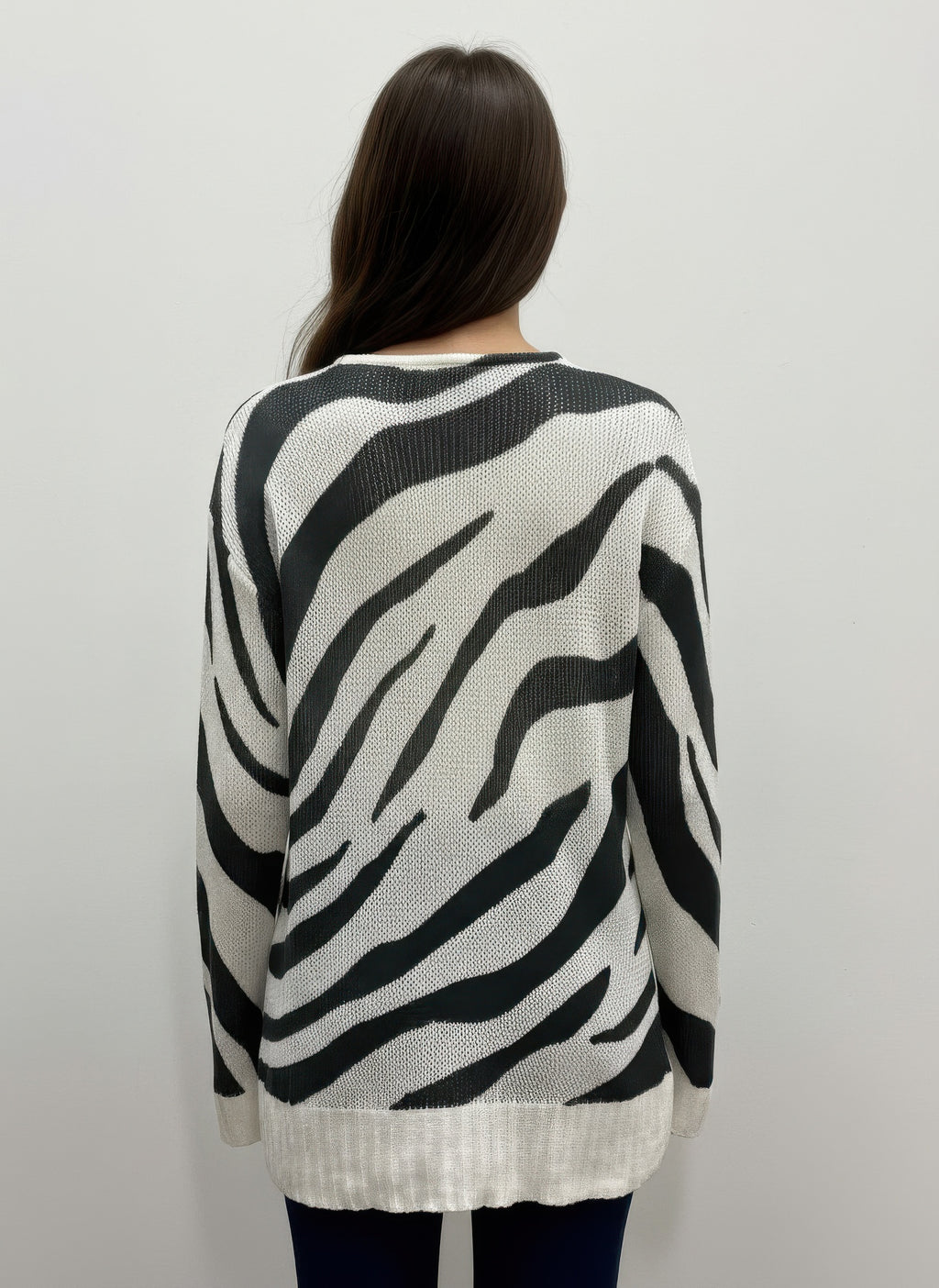 Pull-over sweater with zebra stripes, back view, ribbed hem and cuffs