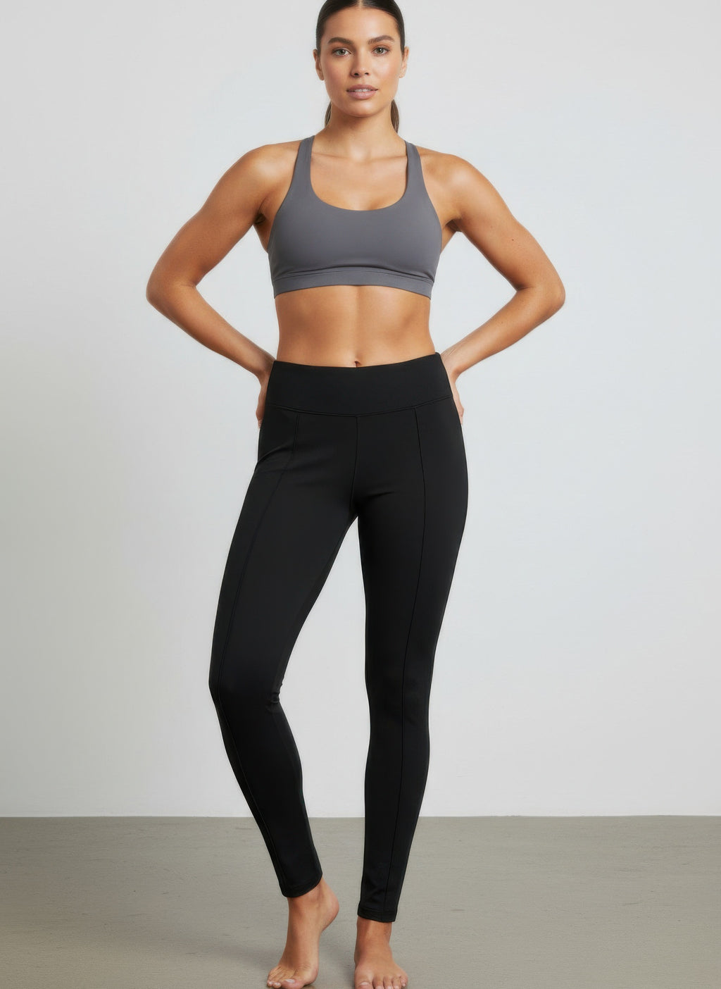 Solid black pull-on pants with tapered legs and elastic waist