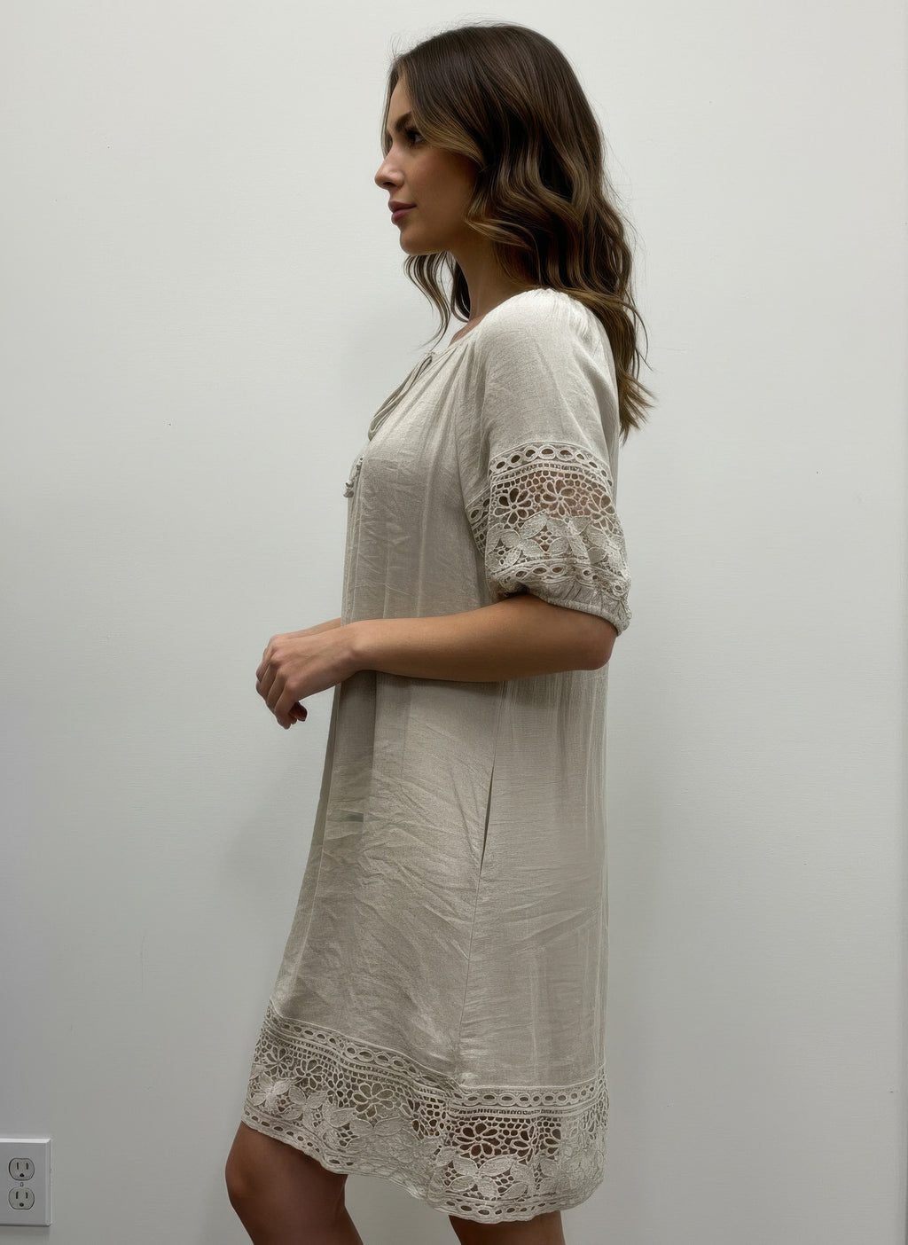 Solid short sleeve dress, cream, lace-trim sleeves and hem, side view
