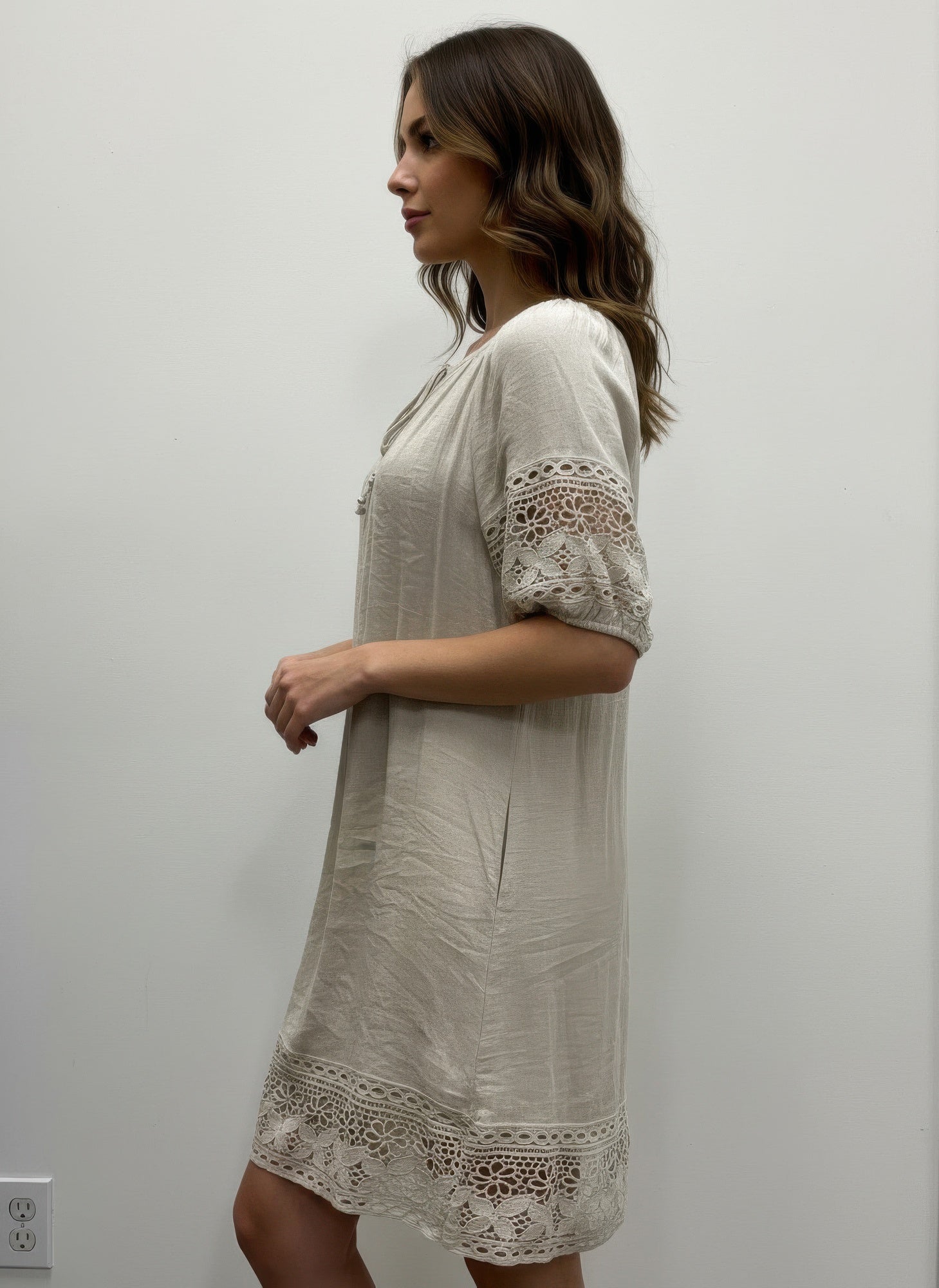 Solid short sleeve dress, cream, lace-trim sleeves and hem, side view