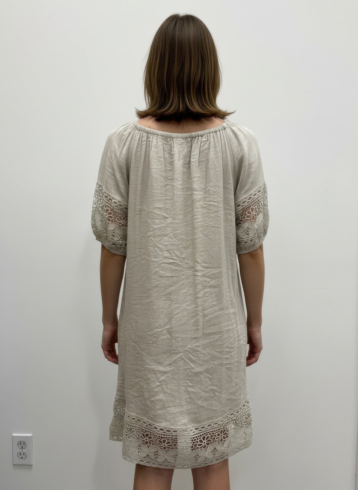 Solid short sleeve dress, cream, back view with lace-trimmed cuffs and hem